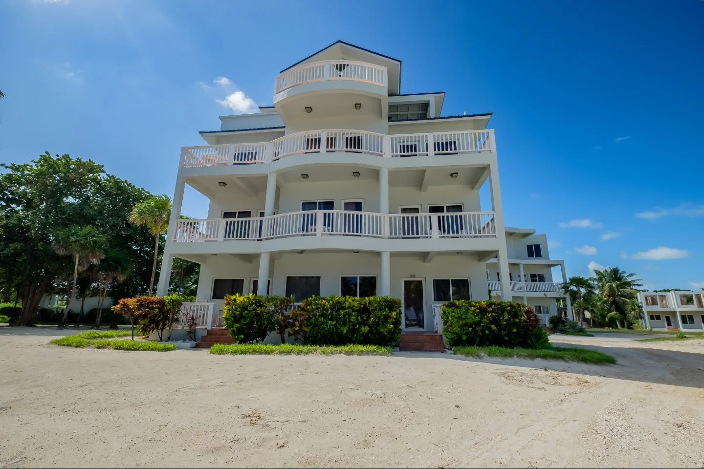 $200,000 for a furnished beachfront condo with a pool, an on-site restaurant and bar, a spa, 24/7 security, and a shuttle that runs to San Pedro. The rental program through Sapphire Beach Rentals handles bookings, guests, and maintenance. You show up