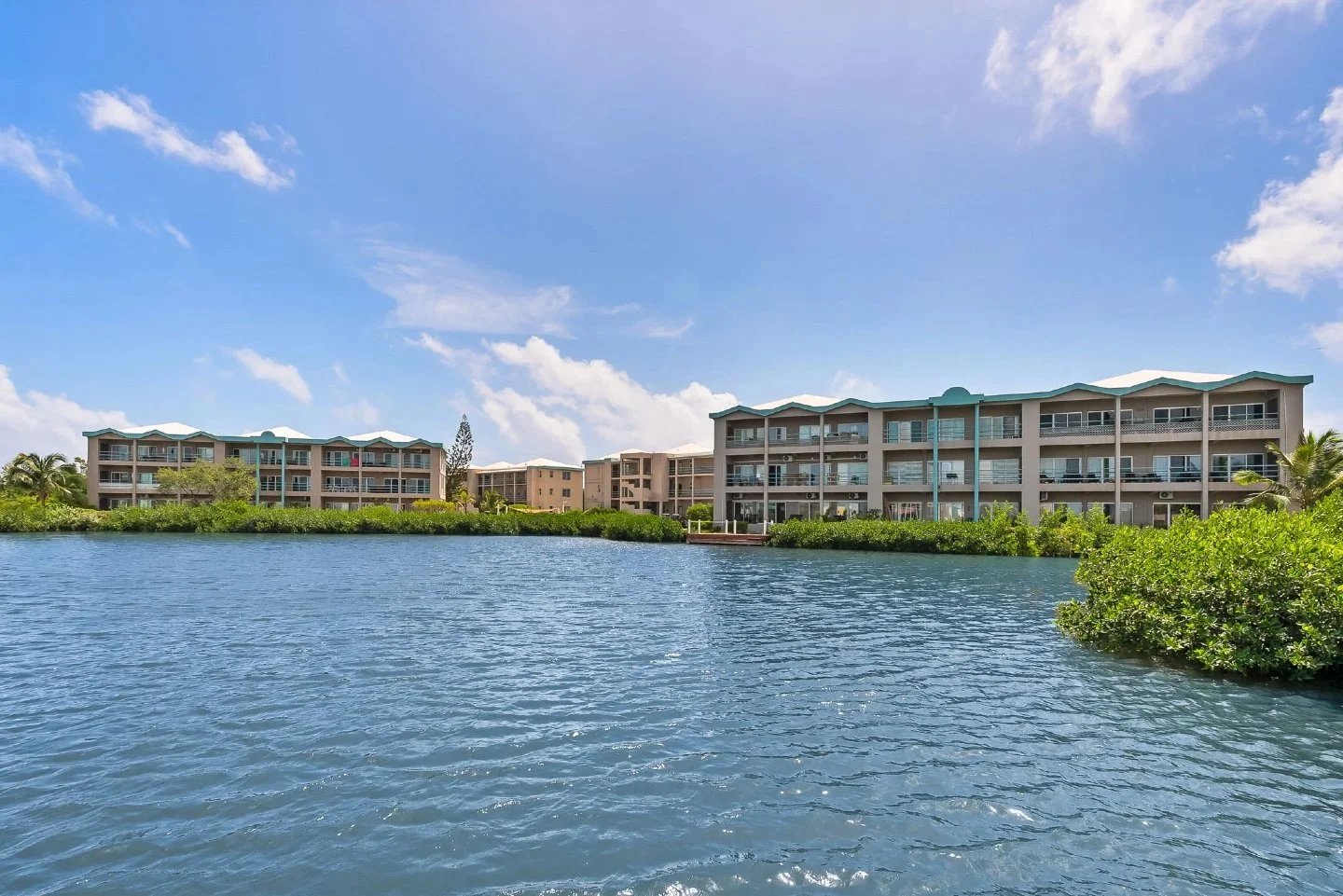 The veranda on B203 faces west, which means sunset over the lagoon every evening. Sliding glass doors connect from each bedroom and the living area, so the line between inside and outside is pretty much wherever you decide to draw it. That's not an a