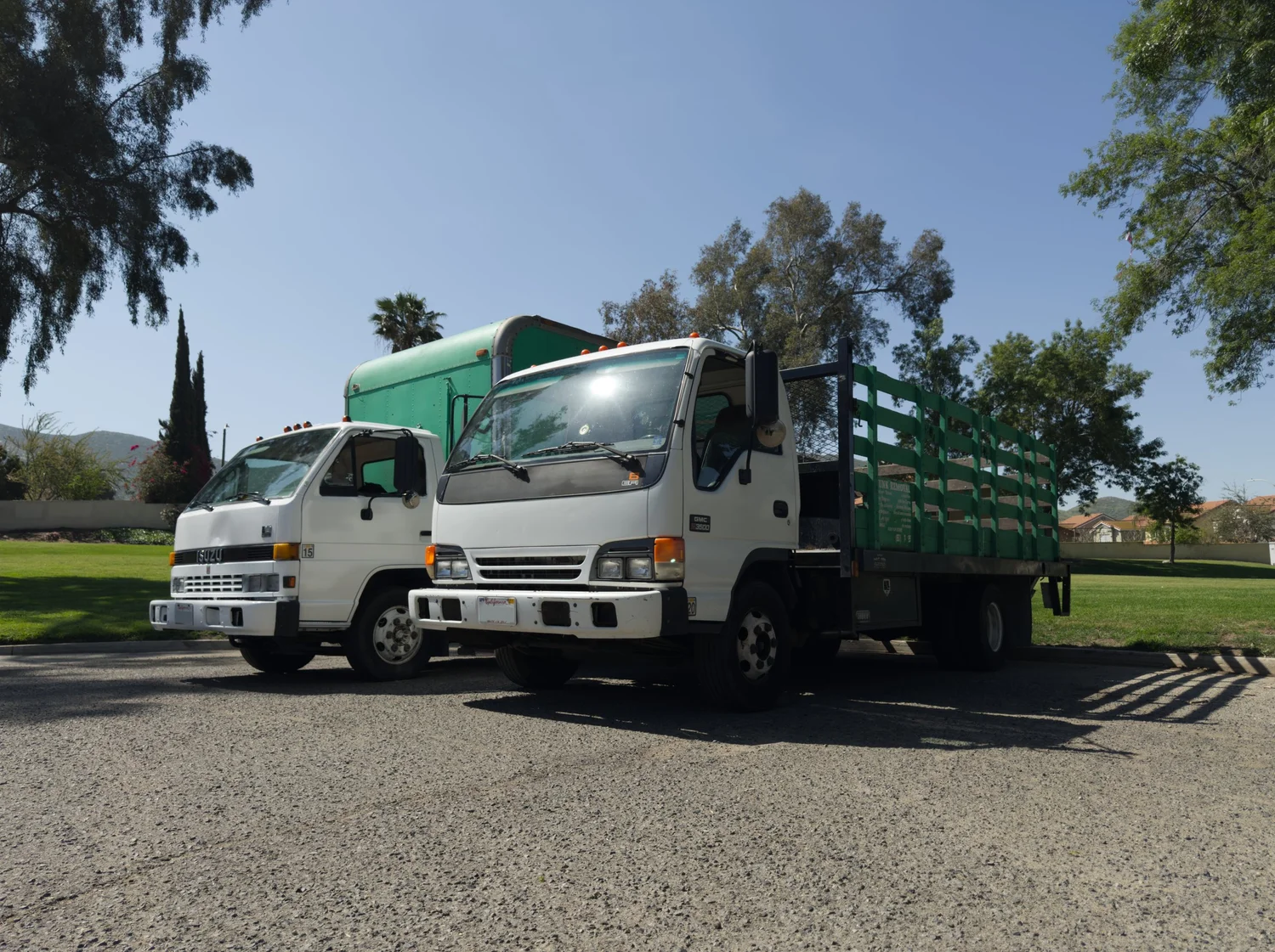 Two Sustainable Cleanouts work trucks ready for junk removal near Riverside