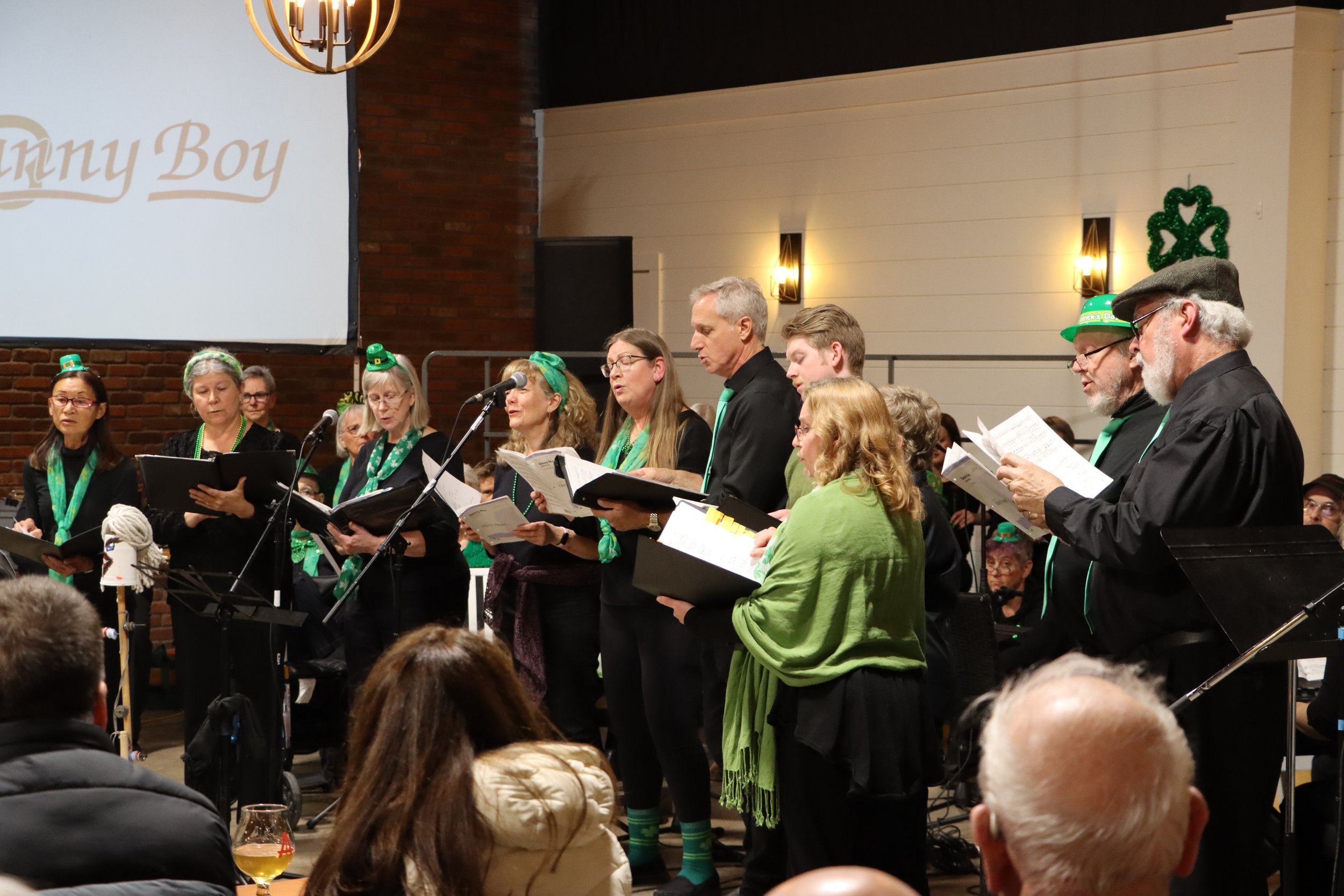 Harmony and Hops: Huntsville Community Choir Rings in St. Patrick’s Day at Canvas Brewing 