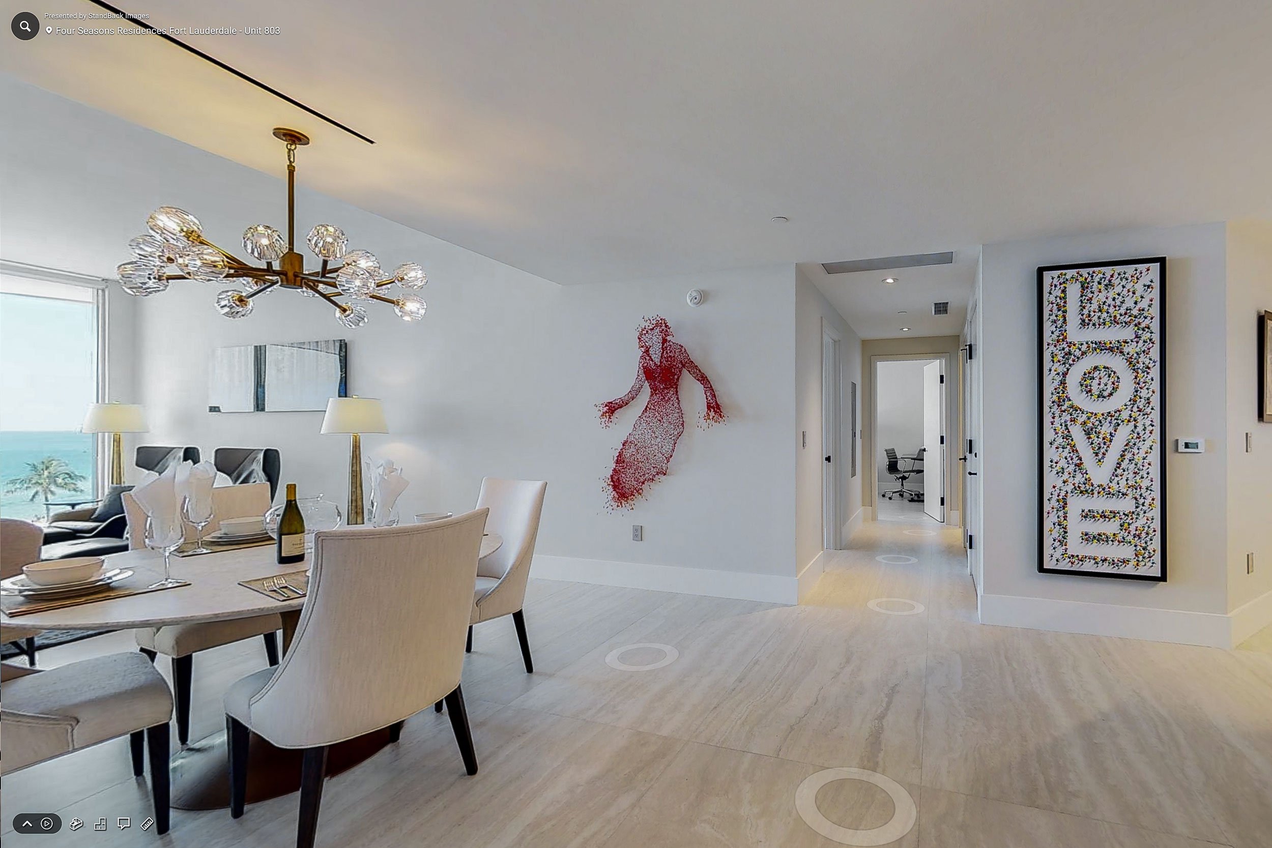 Zillow 3D Home Tour showcasing a luxury Miami condominium with an open-concept living and dining area, professionally captured by SoFlo RE Visuals. Copy