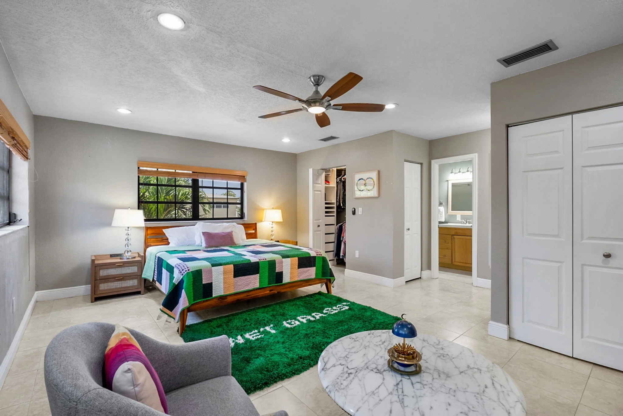 Spacious primary bedroom in a Coral Gables home with en-suite bathroom and walk-in closet.