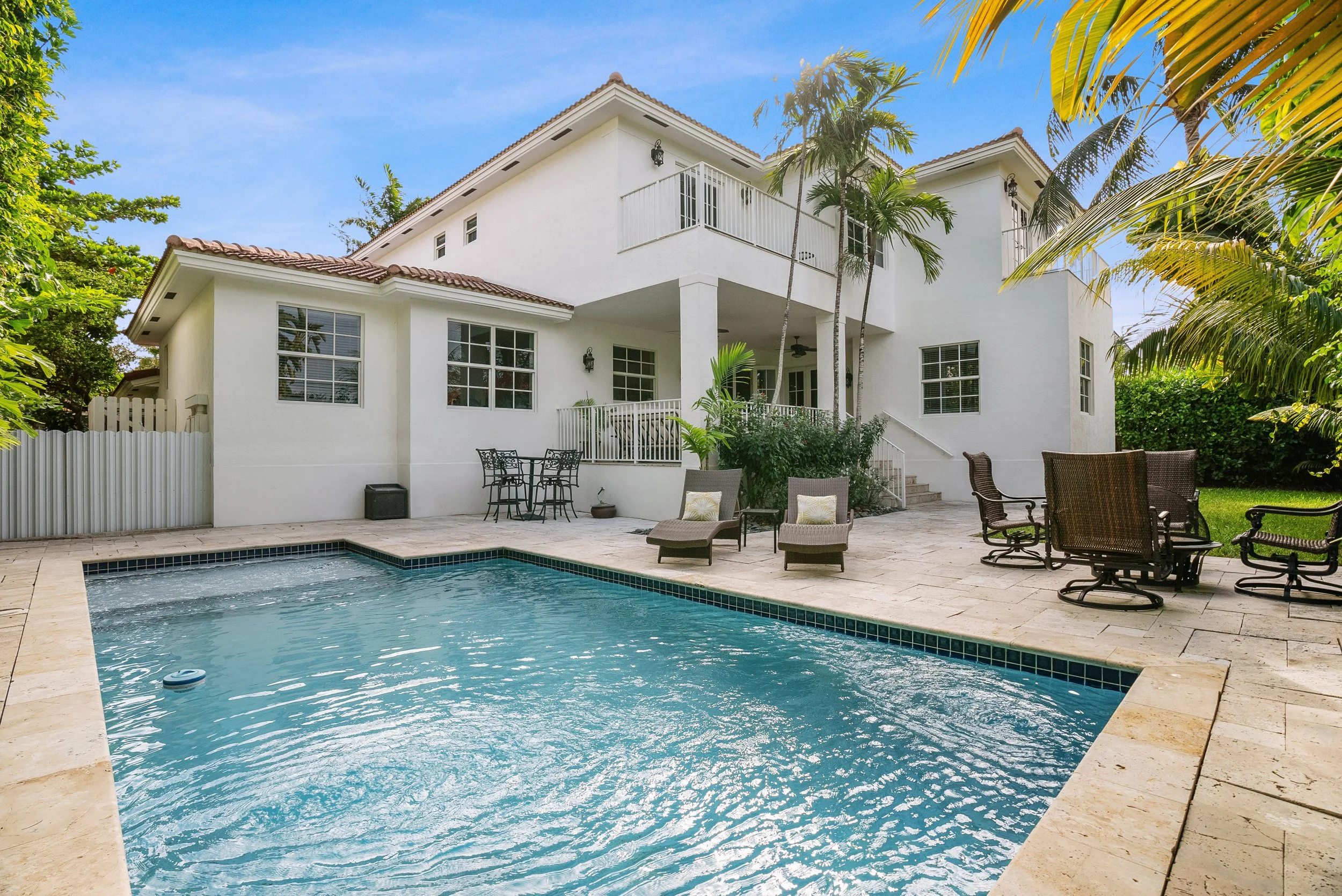 Key Biscayne home with private swimming pool, patio and tropical landscaping.