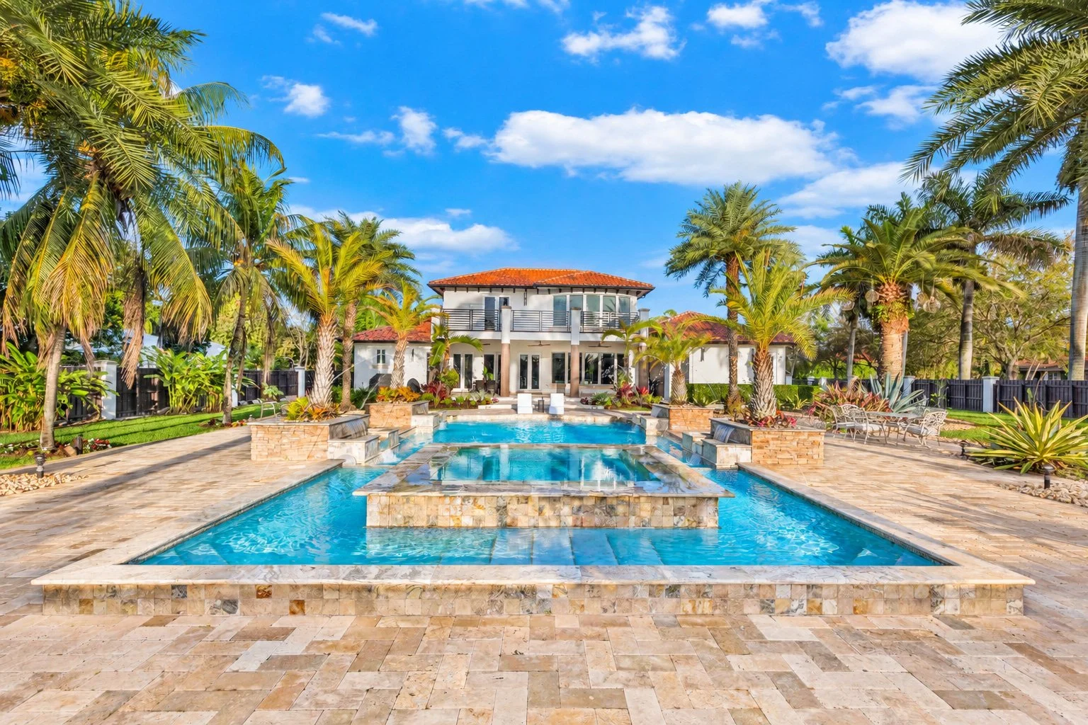 Luxury Homestead and Redland estate with resort-style pool and tropical landscaping.