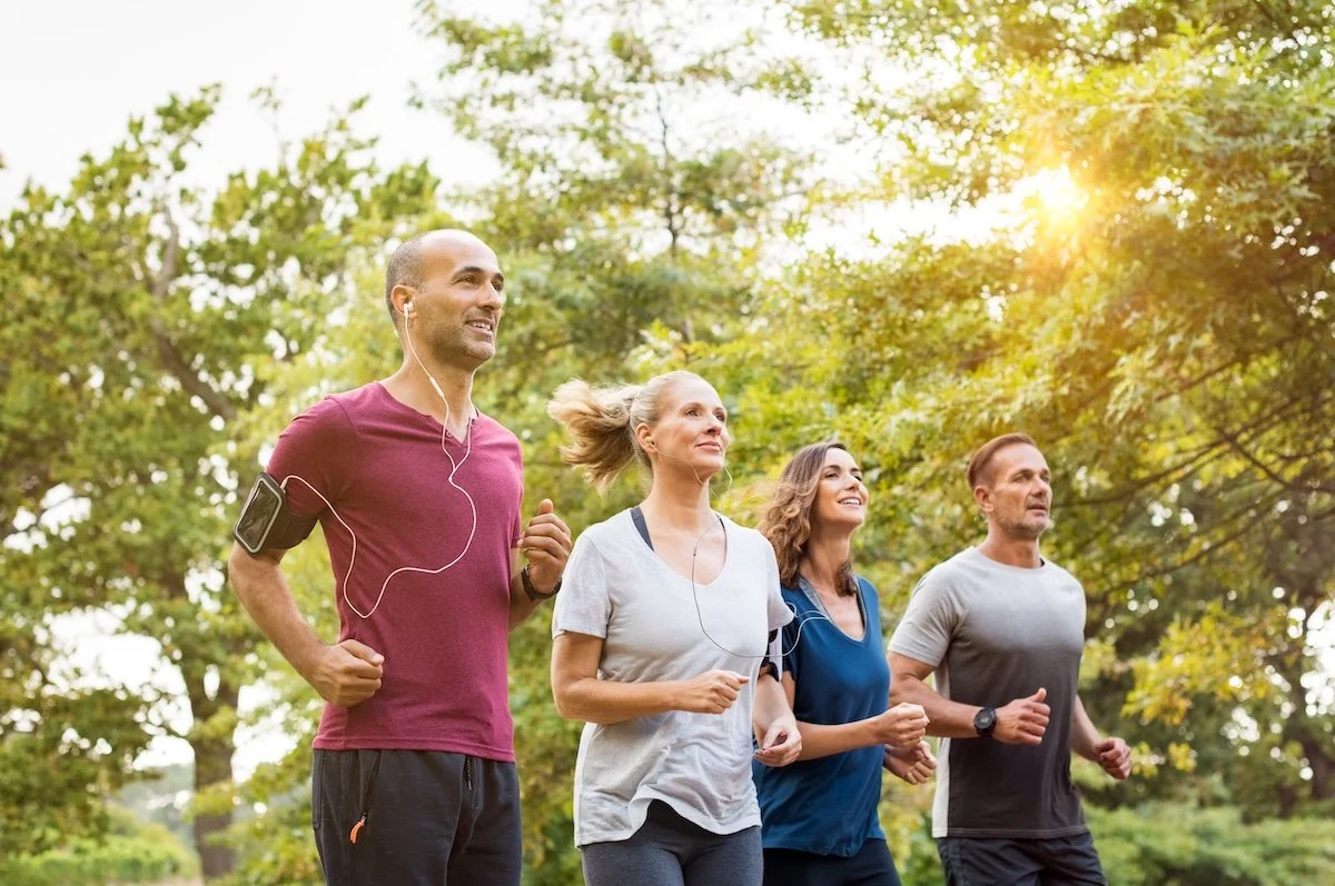 middle age adults running outside