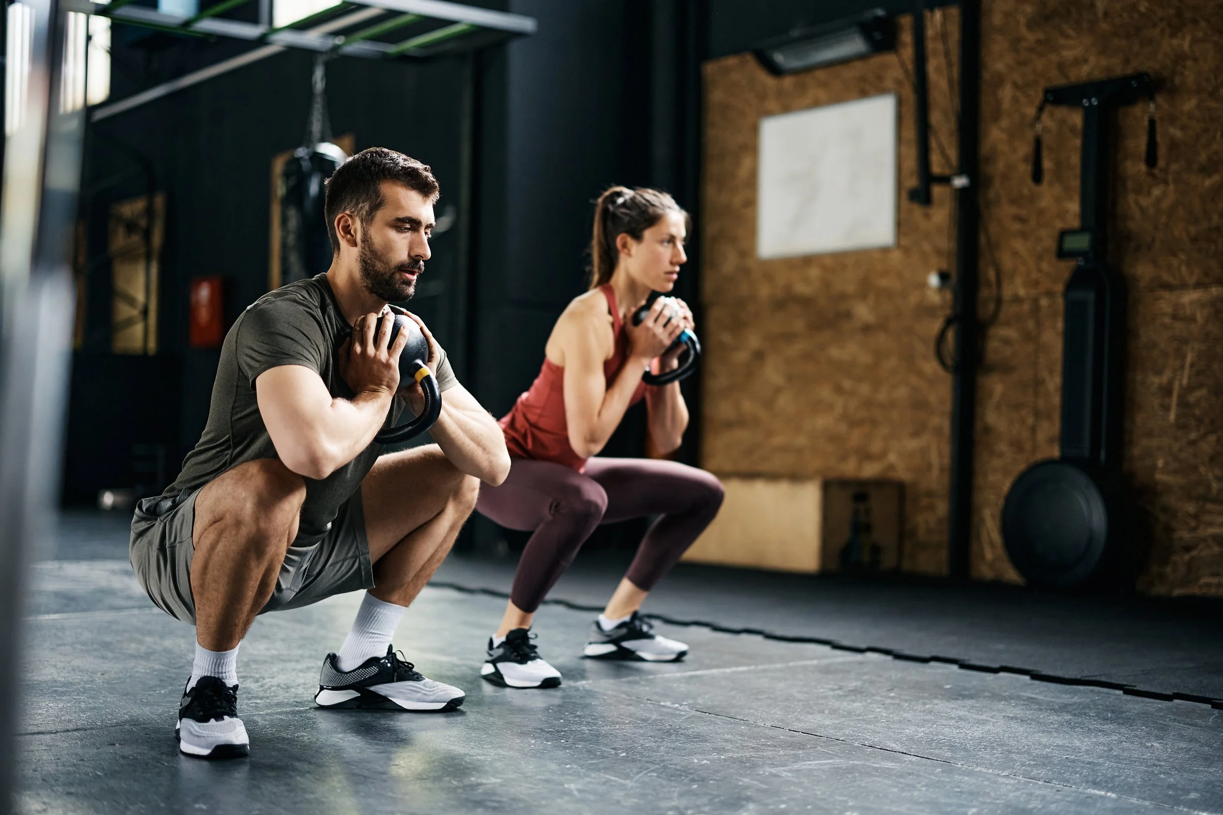 Man and woman working out in a gym
