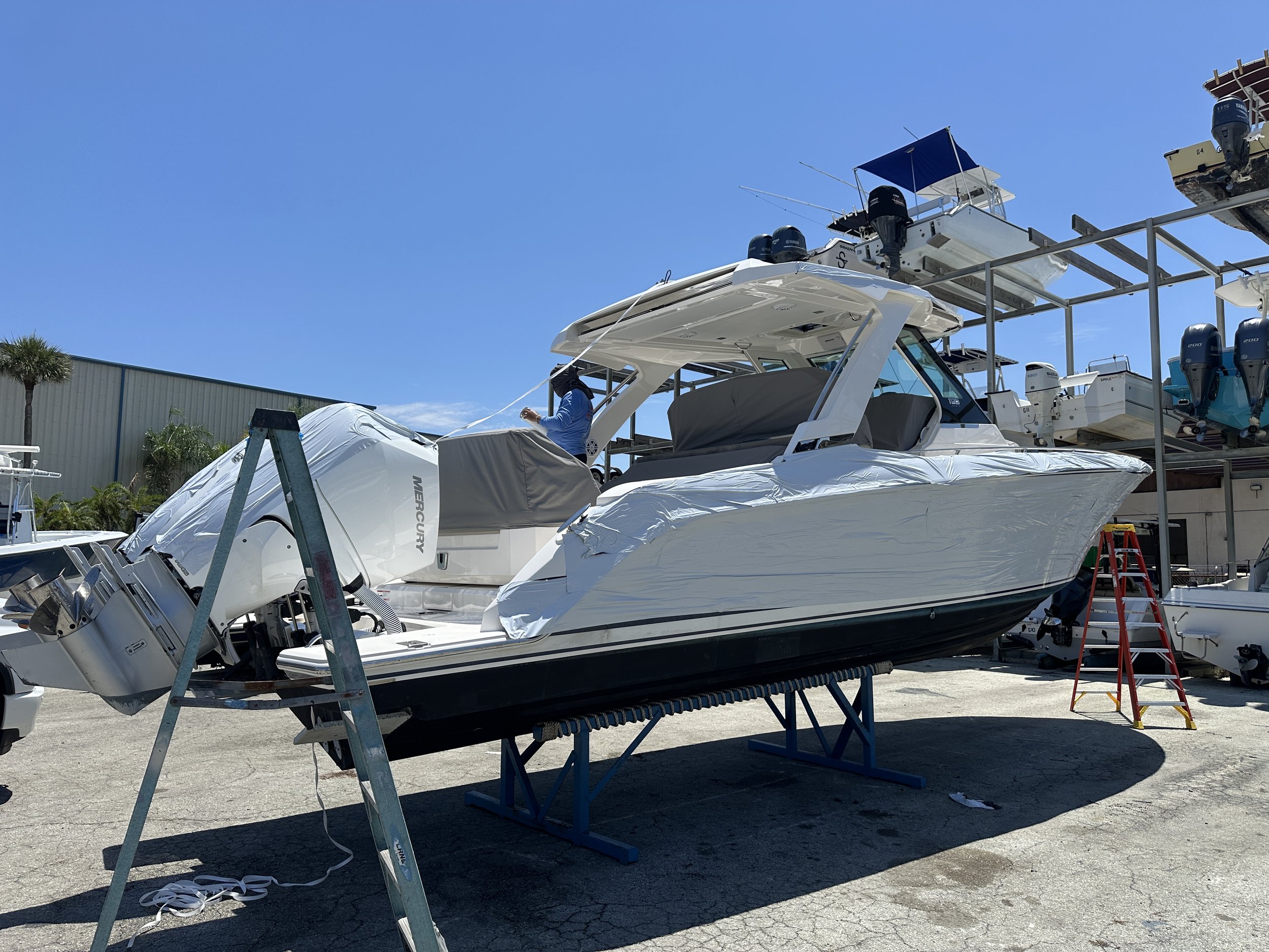 Boat secured on haul-out stand for hurricane and storm preparation