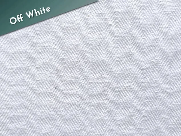 Off white cotton coutil fabric with a herringbone weave