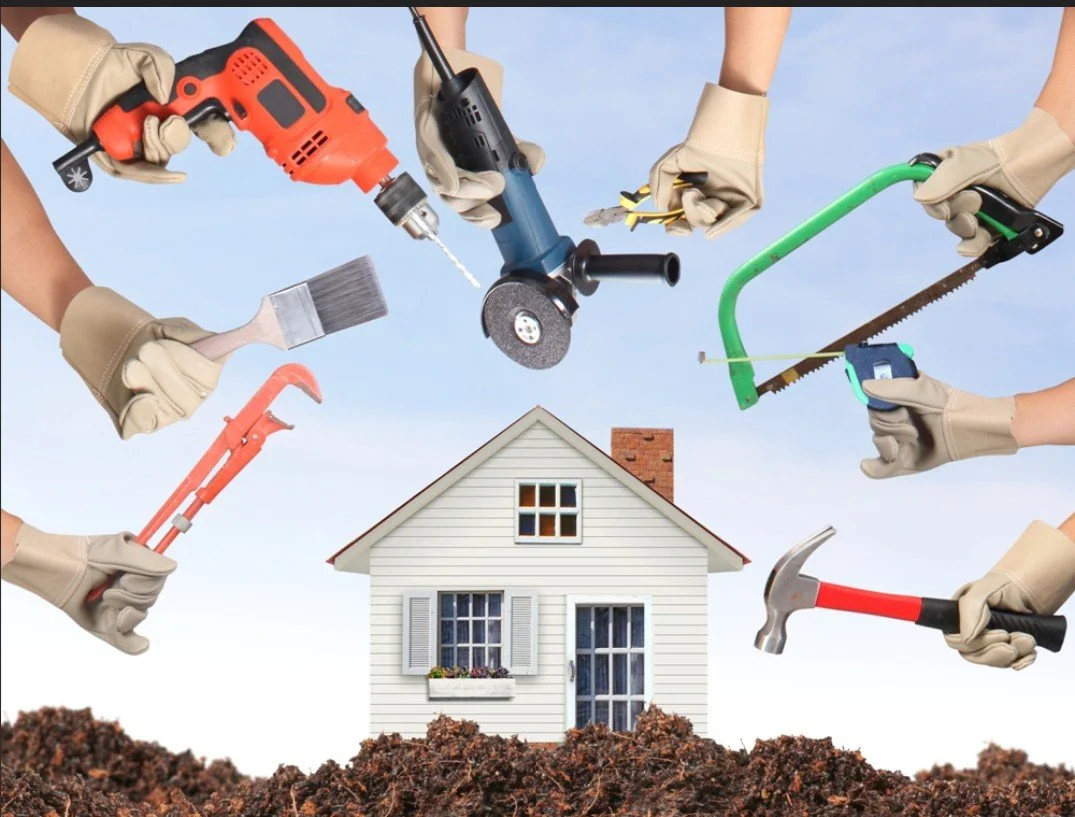 Multiple hands wearing gloves holding various tools such as a drill, paintbrush, circular saw, hack saw, hammer, pipe wrench, and crowbar hovering over a small white house with a front window and door, against a blue sky background.
