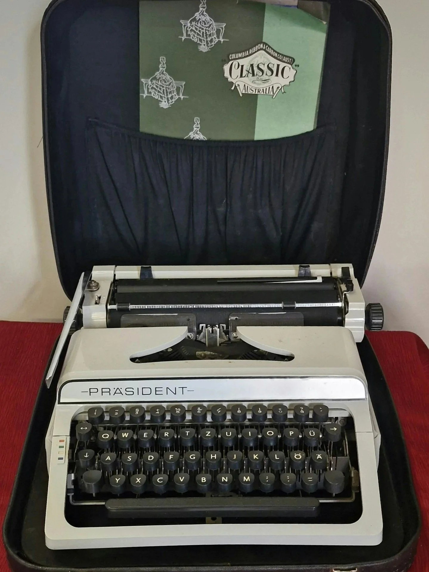 "Dear diary, 

Today, I stumbled upon a pristine Prasident Portable Typewriter at Gary's Bazaar. It was in excellent working condition and came with a sturdy case for just $249! This vintage gem would be an ideal companion for my writing journey