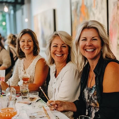 Ladies smiling at a textured art workshop