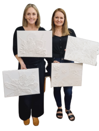 Ladies holding textured art