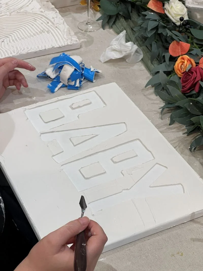 Lady creating baby textured art