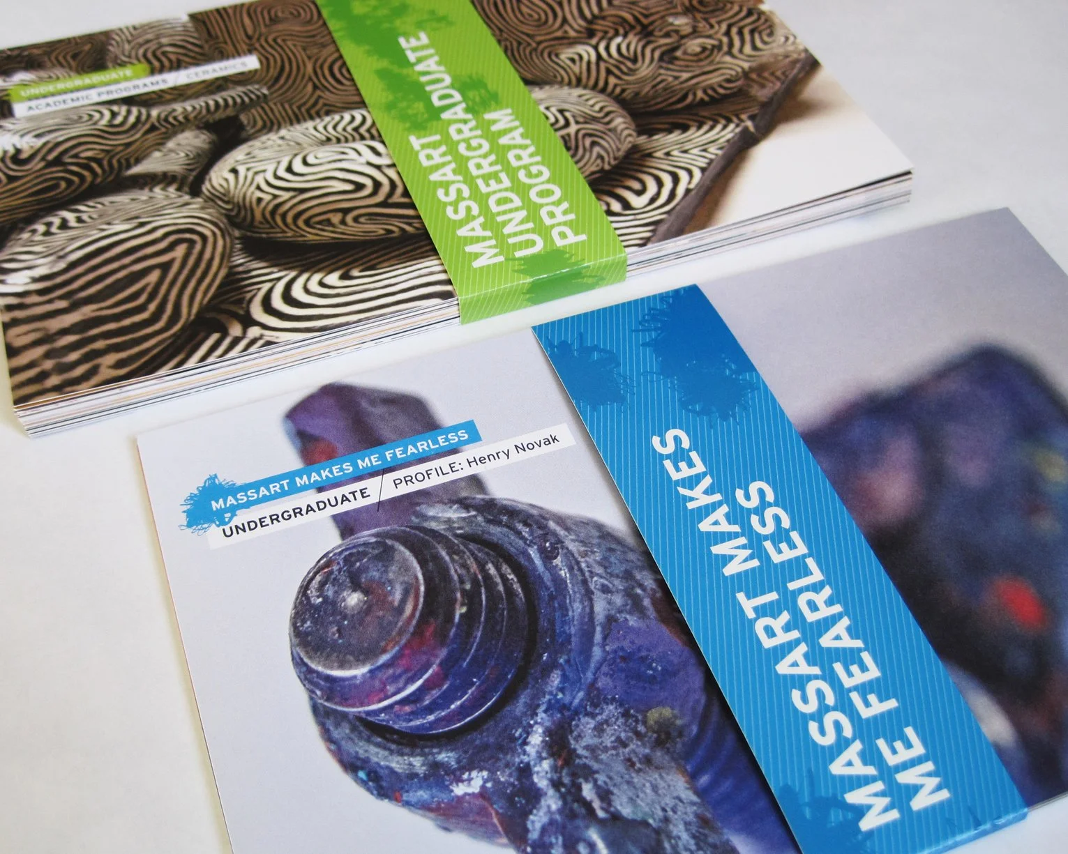 Modular postcards are grouped by category, with content on one side and student art on the other.