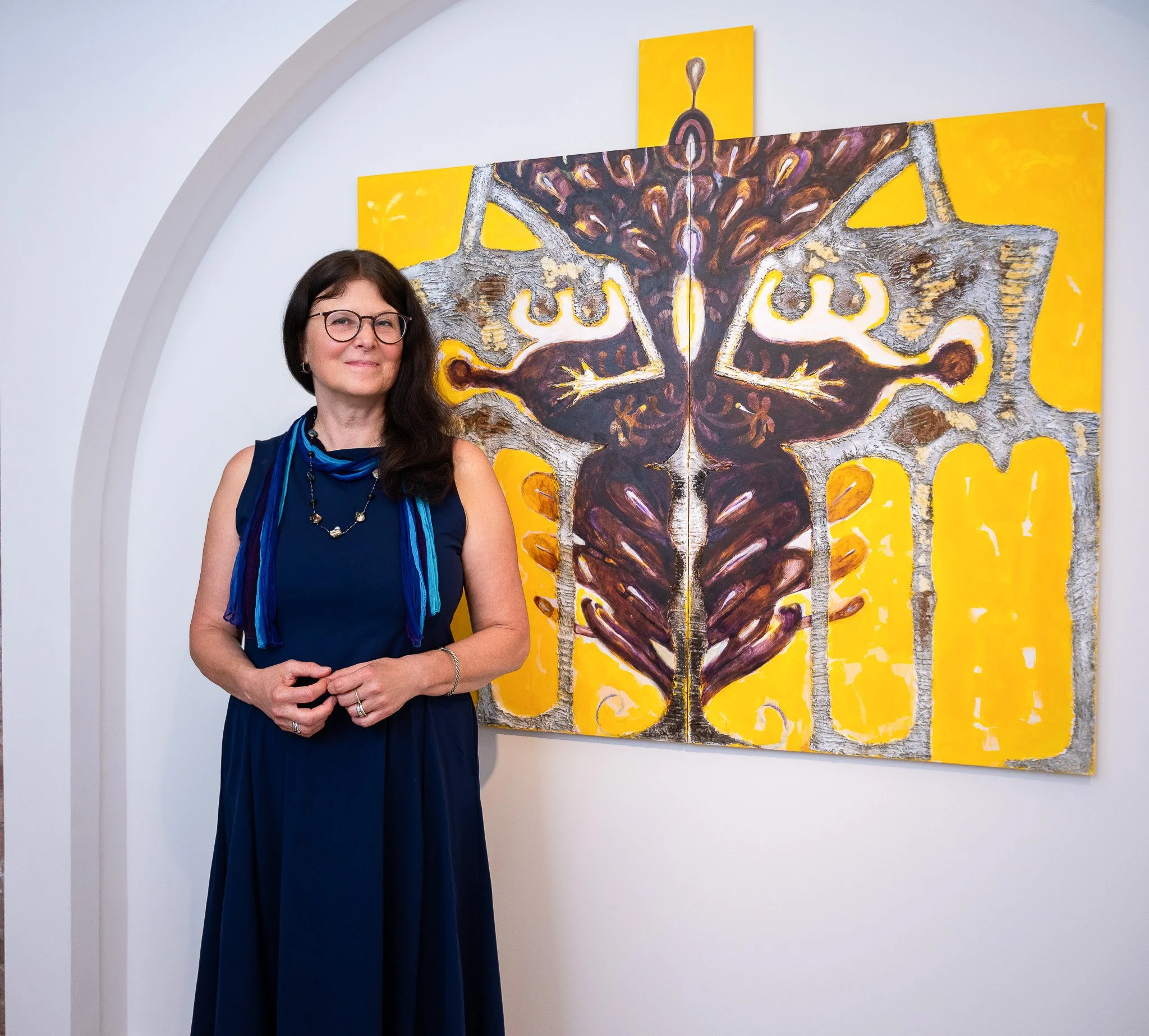 Artist Branding Portrait in Front of Abstract Painting