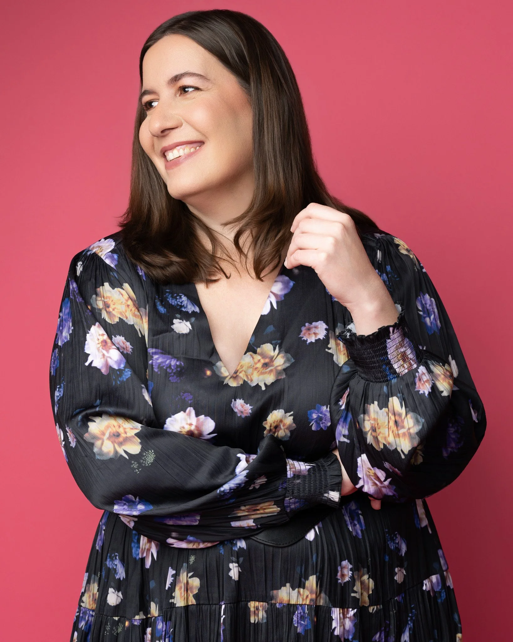 Bright Modern Portrait of Woman in Floral Dress on Pink Studio Backdrop