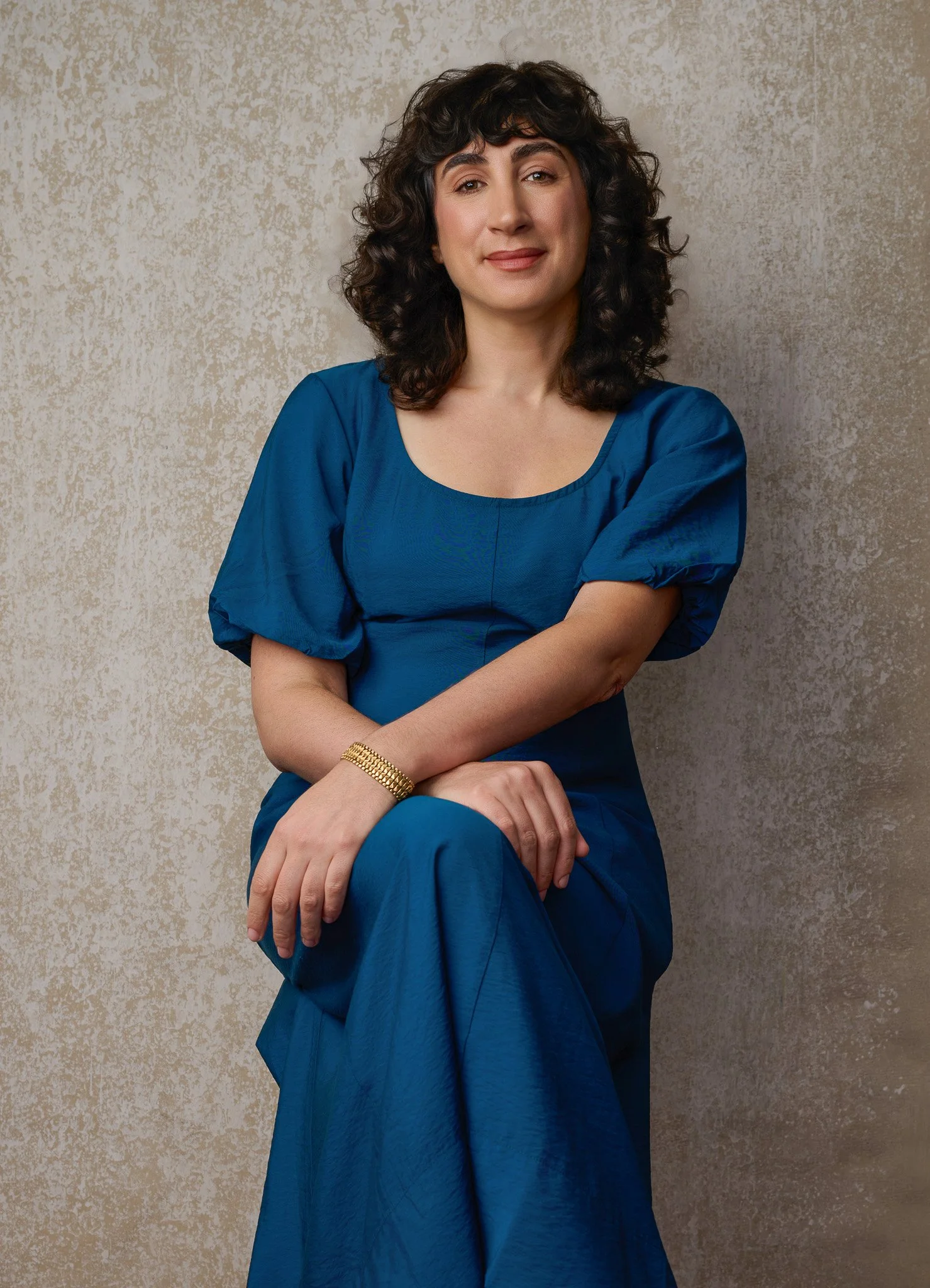 Fine Art-Inspired Portrait of Woman in Blue Dress Against Textured Background