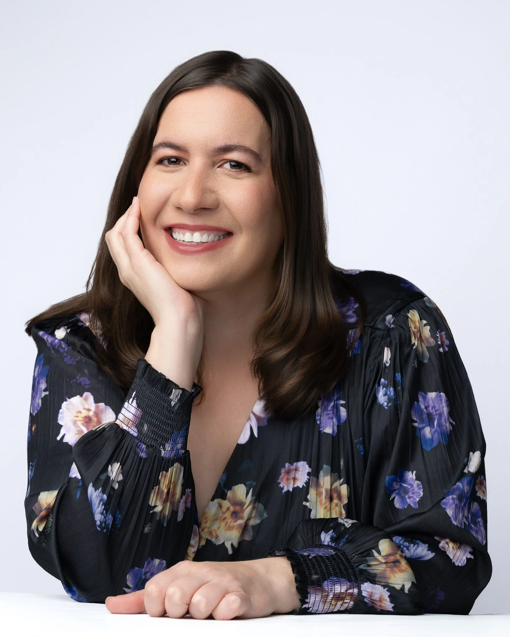 Modern Studio Portrait of Woman in Floral Dress With Relaxed Pose