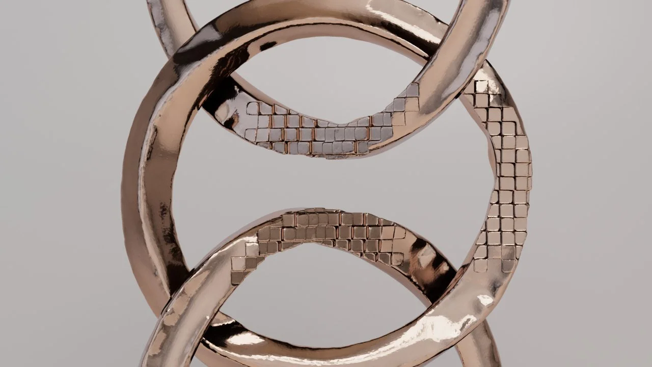 金色のリングが絡み合っている写真