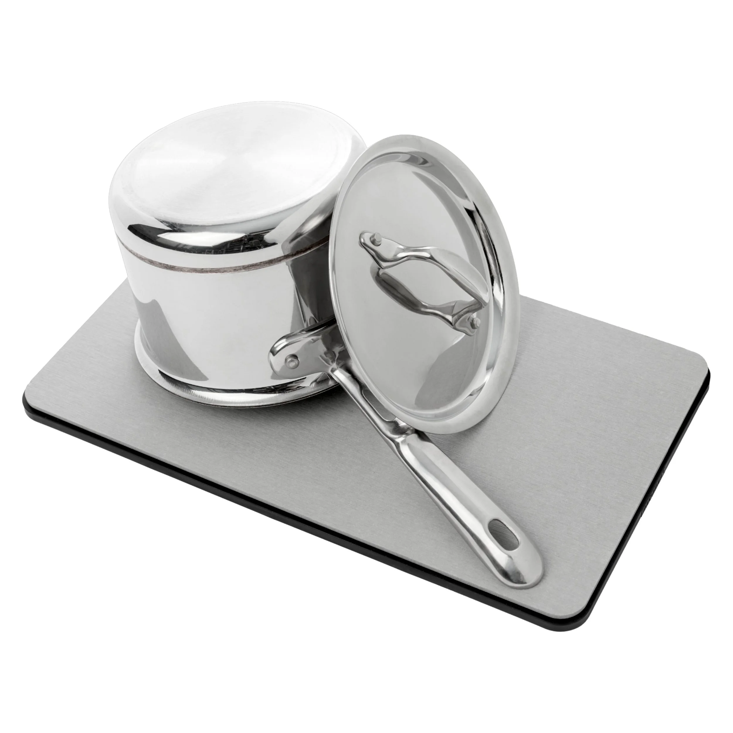 A silver, stainless steel saucepan with a glass lid, placed on a kitchen scale with a flat, gray surface.