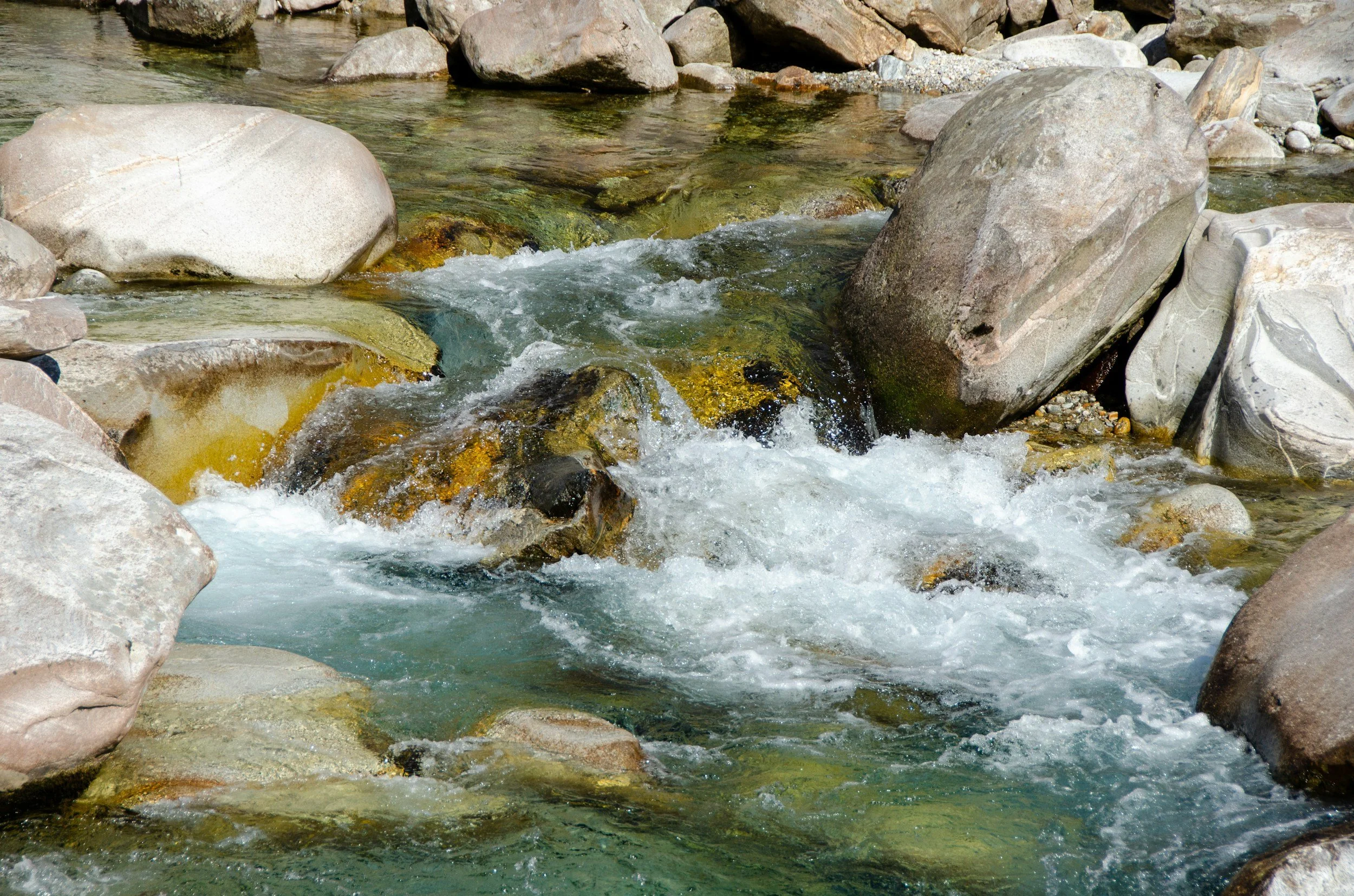 water running over rocks, close up