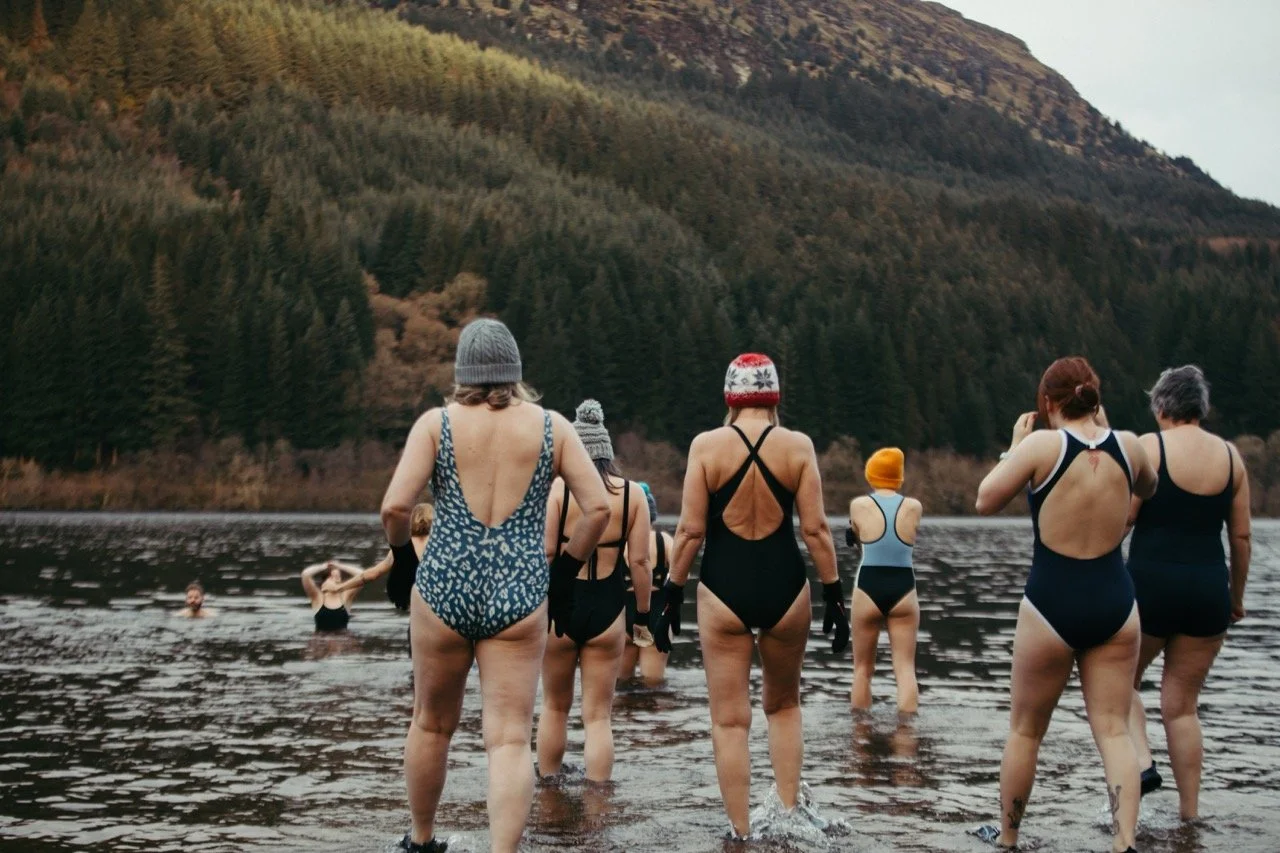 women swimming in cold water