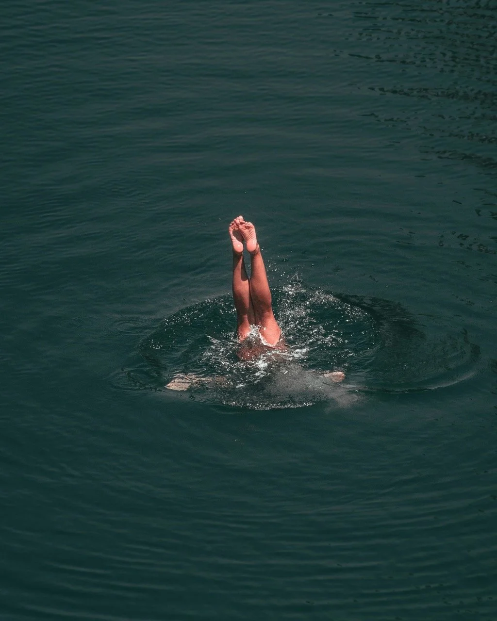 woman diving into deep water.jpeg