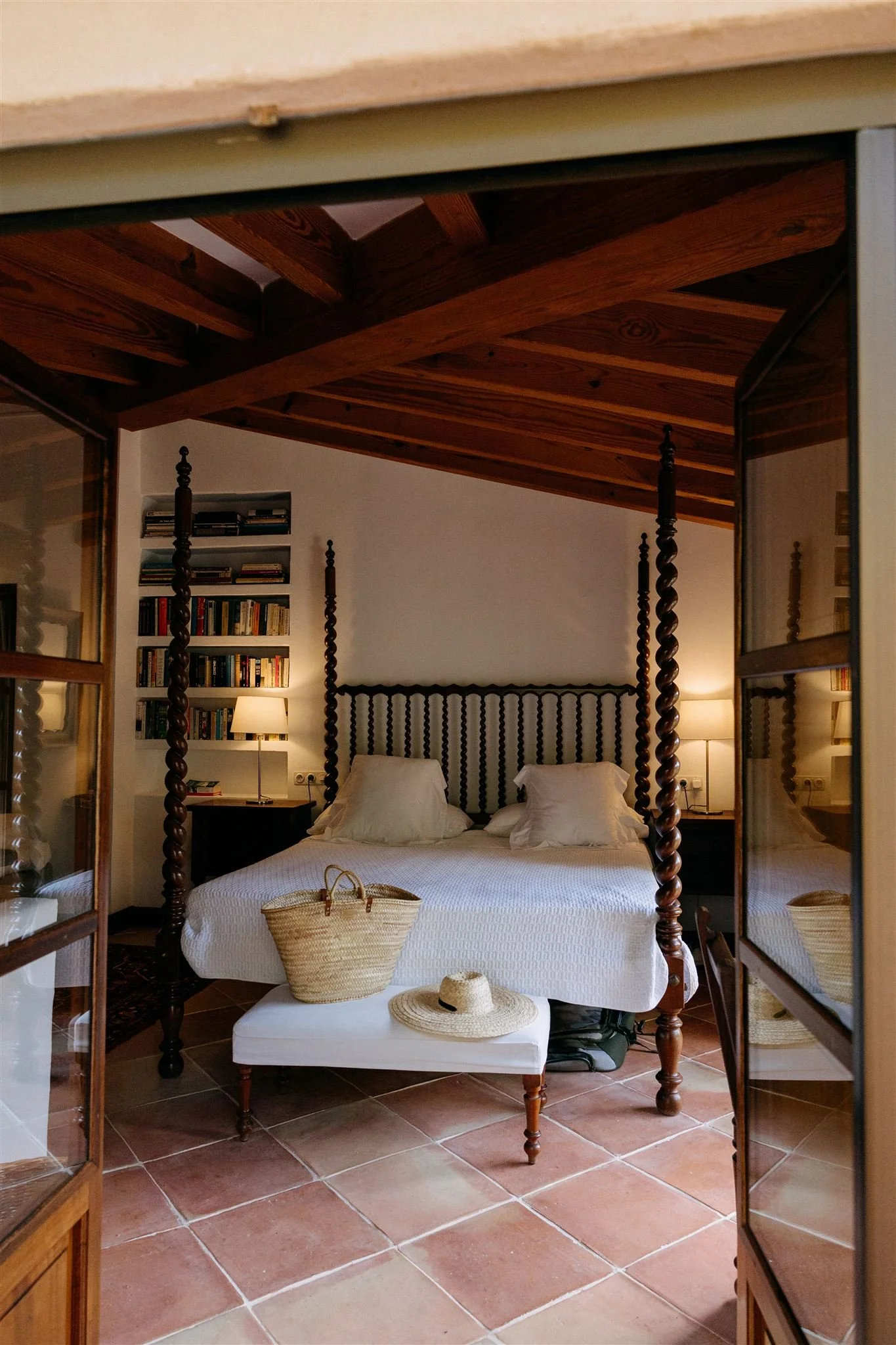 beautiful mallorcan bedroom at finca son salas with straw basket and sun hat