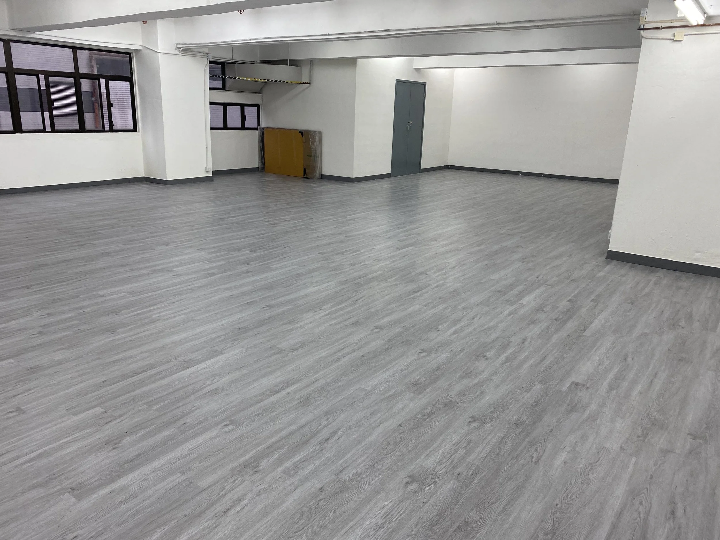 A high-angle view of the empty 2,200 sq. ft. versatile open layout space of Room 2 at The Hang in Wong Chuk Hang.