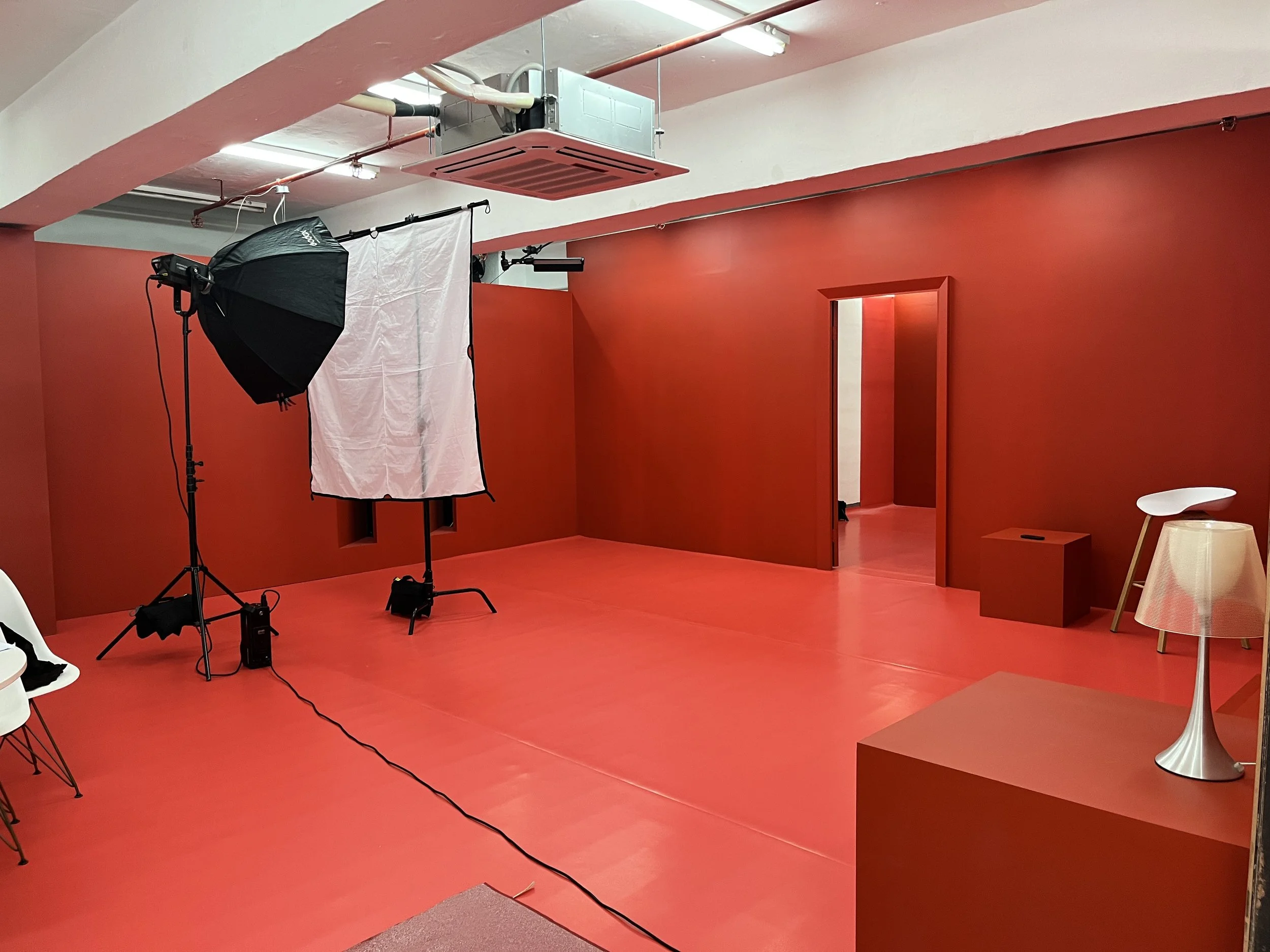 A professional corporate filming and video production studio setup inside the open-layout room at The Hang Event Space, Hong Kong.