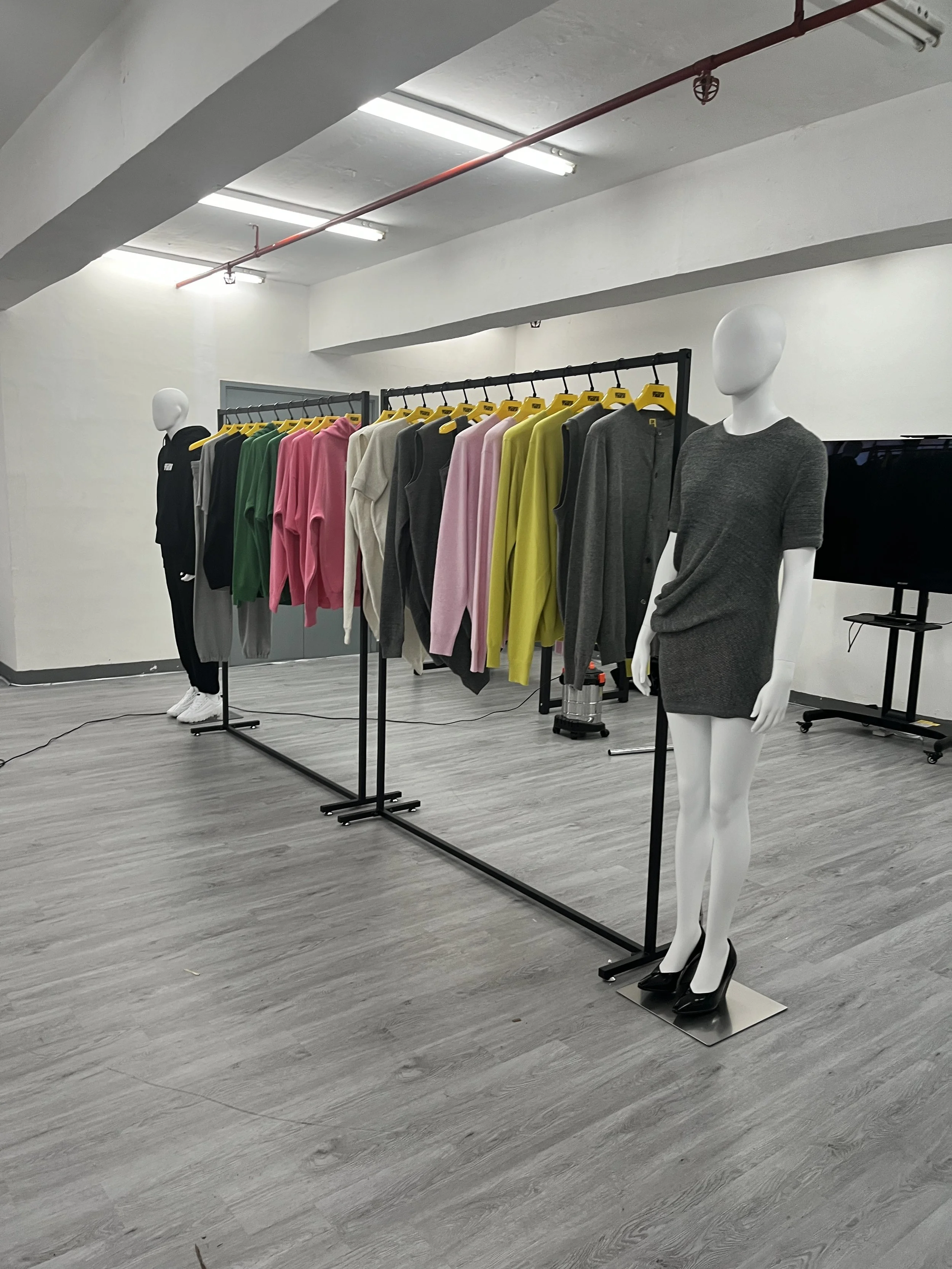 A modern brand showroom and product launch exhibition display setup showing a bright, clean commercial venue space in Hong Kong.