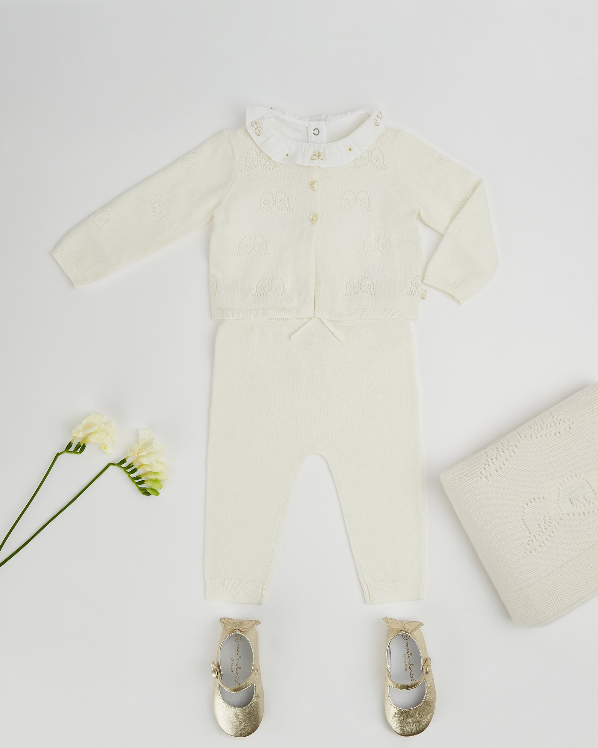 Angel Wing knitted cardgian – cream Angel Wing Ruffle collar onesie Angel Wing knitted trouser – cream Cashmere Blanket - Cream Olympia slipper – gold Hairbush.jpg
