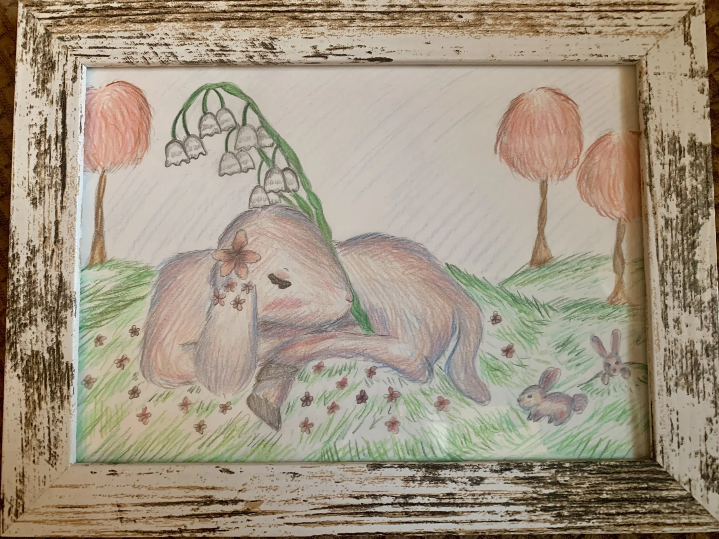 A lamb with rabbits in springtime. Created with colored pencils.