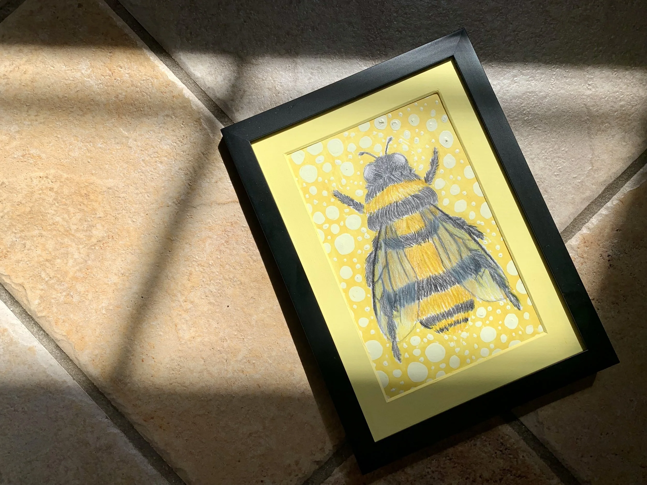Bumblebee on a background of yellow. Created with colored pencils and markers.