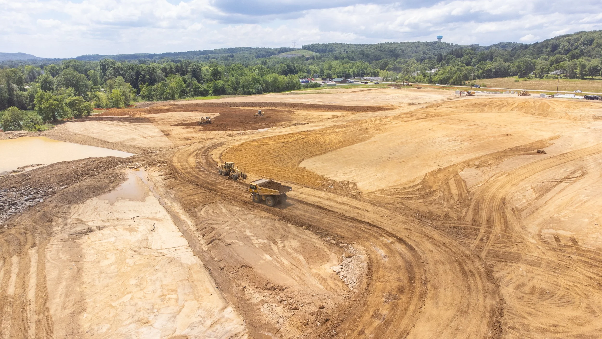 Overhead drone shot of a construction zone in Western Pennsylvania, taken by Ian Jones in Pittsburgh, showcasing industrial development and construction expertise by LaCarte Enterprises.