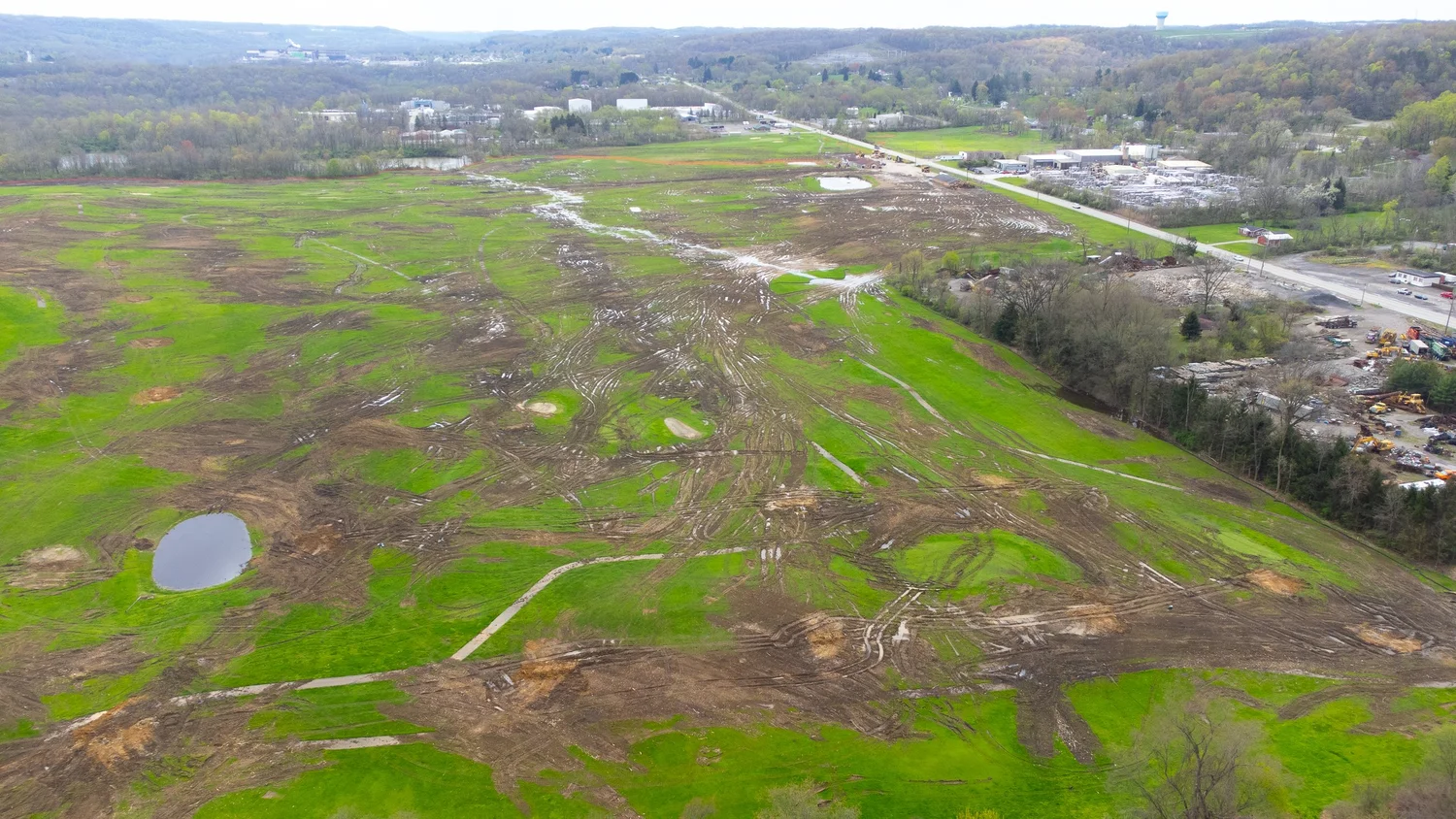 Early aerial view of the Stonecrest site with cleared land and access roads.