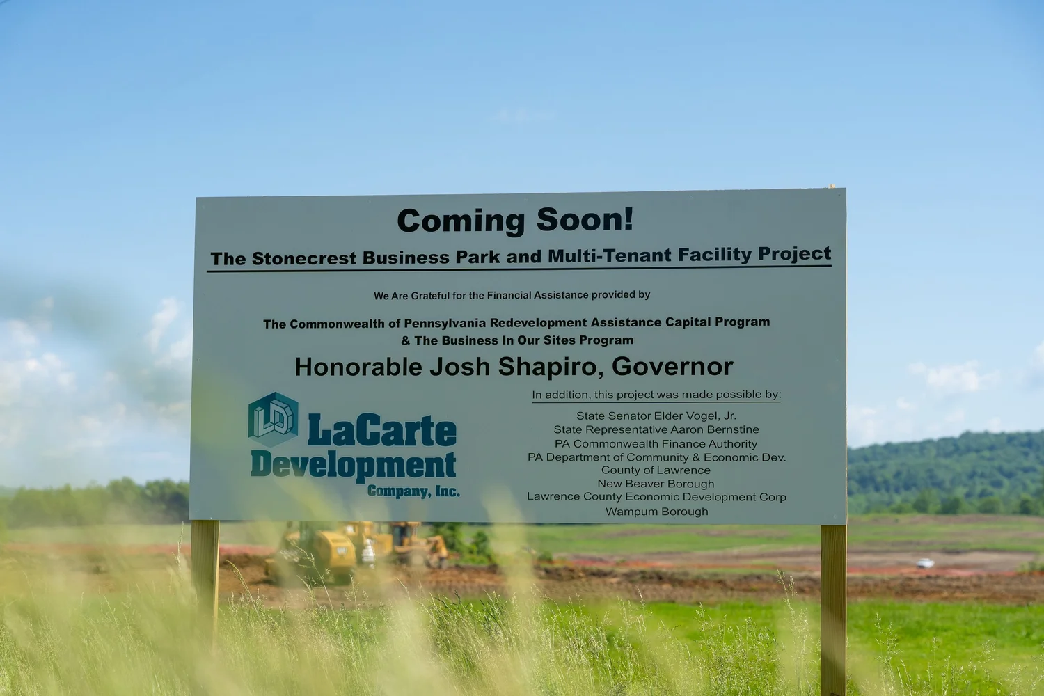 Coming Soon sign for the Stonecrest Business Park and Multi-Tenant Facility Project, crediting state funding programs.
