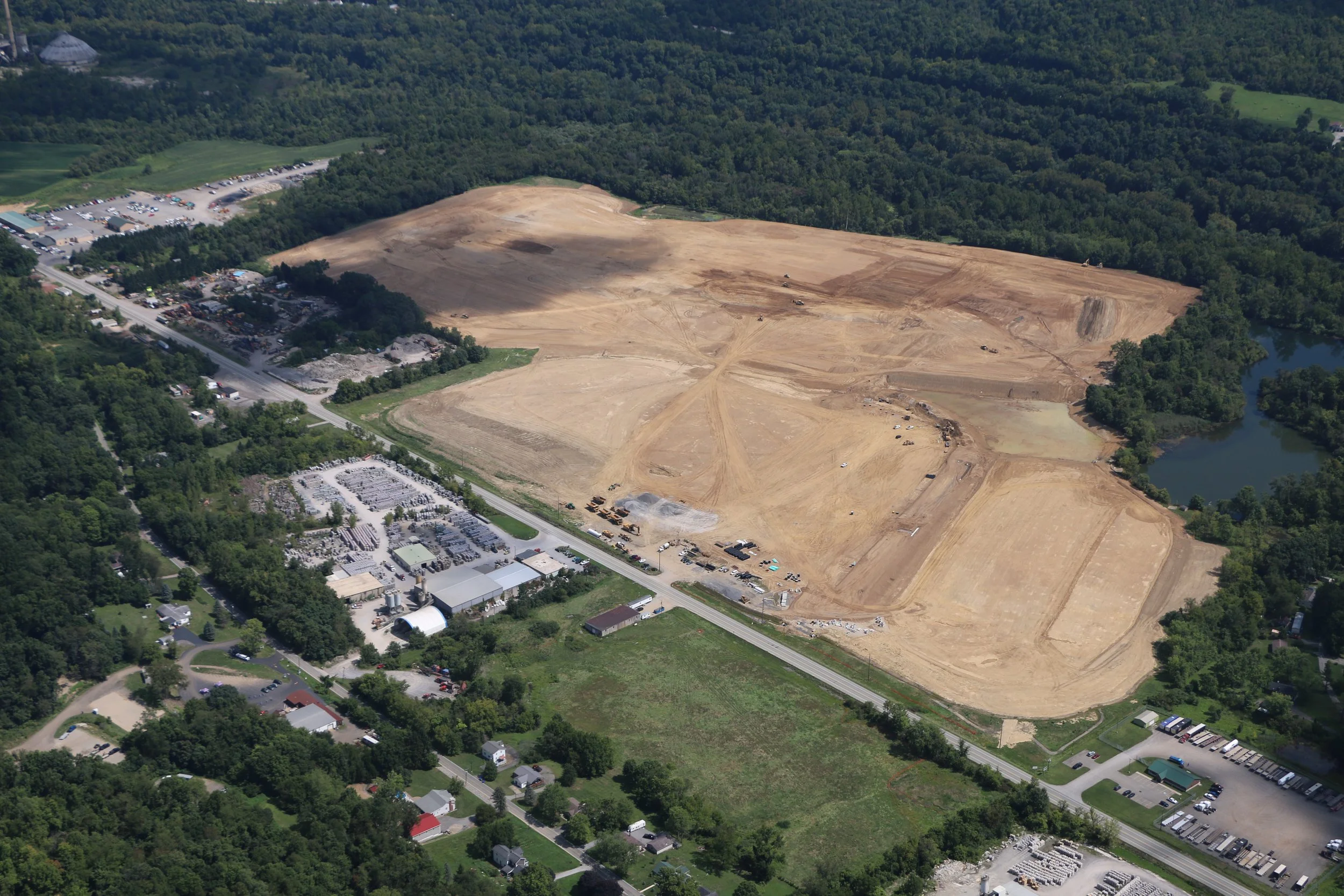 Overhead drone shot of a construction zone in Western Pennsylvania, taken by Ian Jones in Pittsburgh, showcasing industrial development and construction expertise by LaCarte Enterprises.