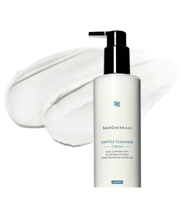 A bottle of SkinCeuticals Gentle Cleanser Cream with some of the cream spread behind it.