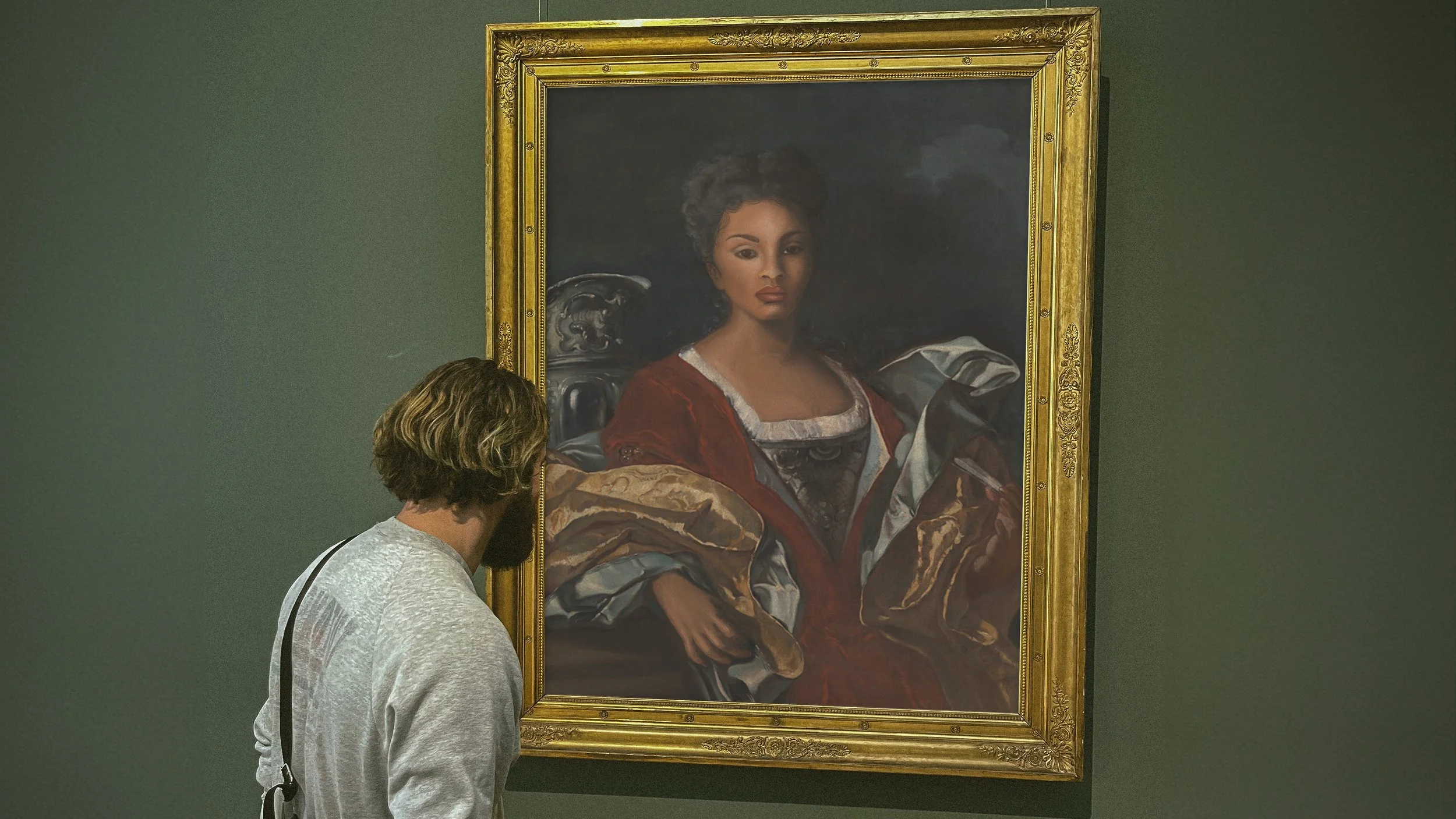 Vertical Frame Poster Mockup with Male Visitor.jpg