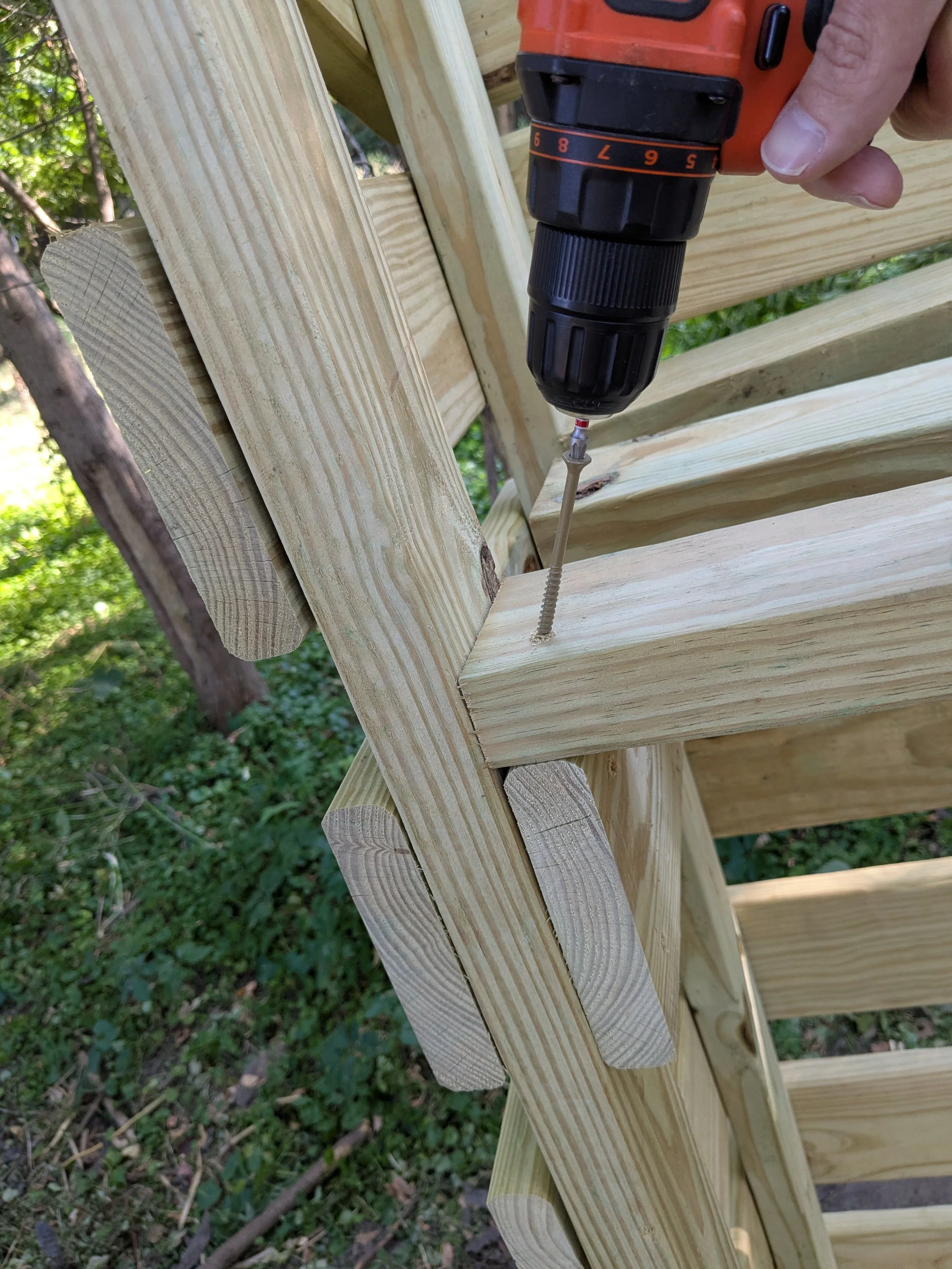 driving a screw into the roof frame joint