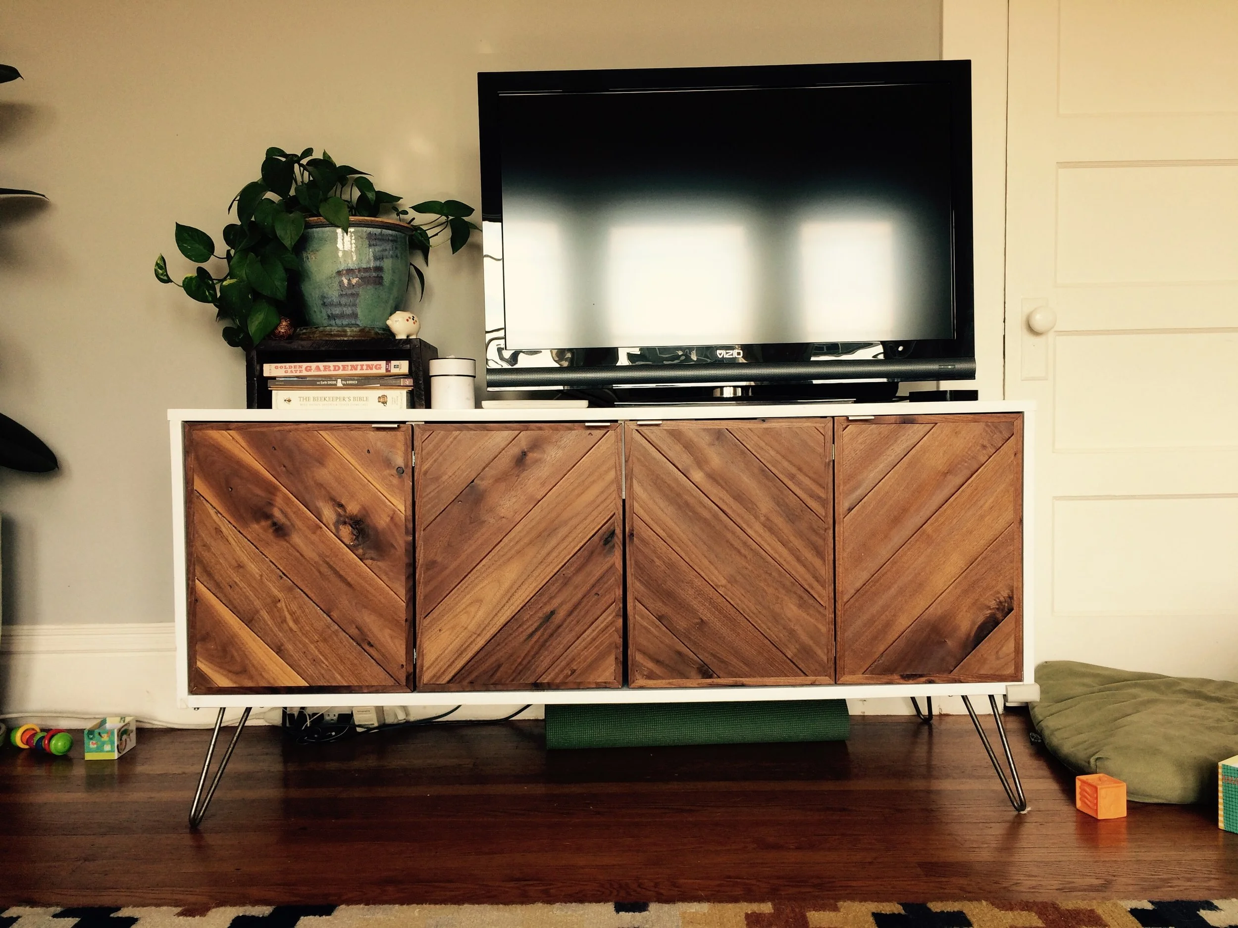 Custom console cabinet with reclaimed materials