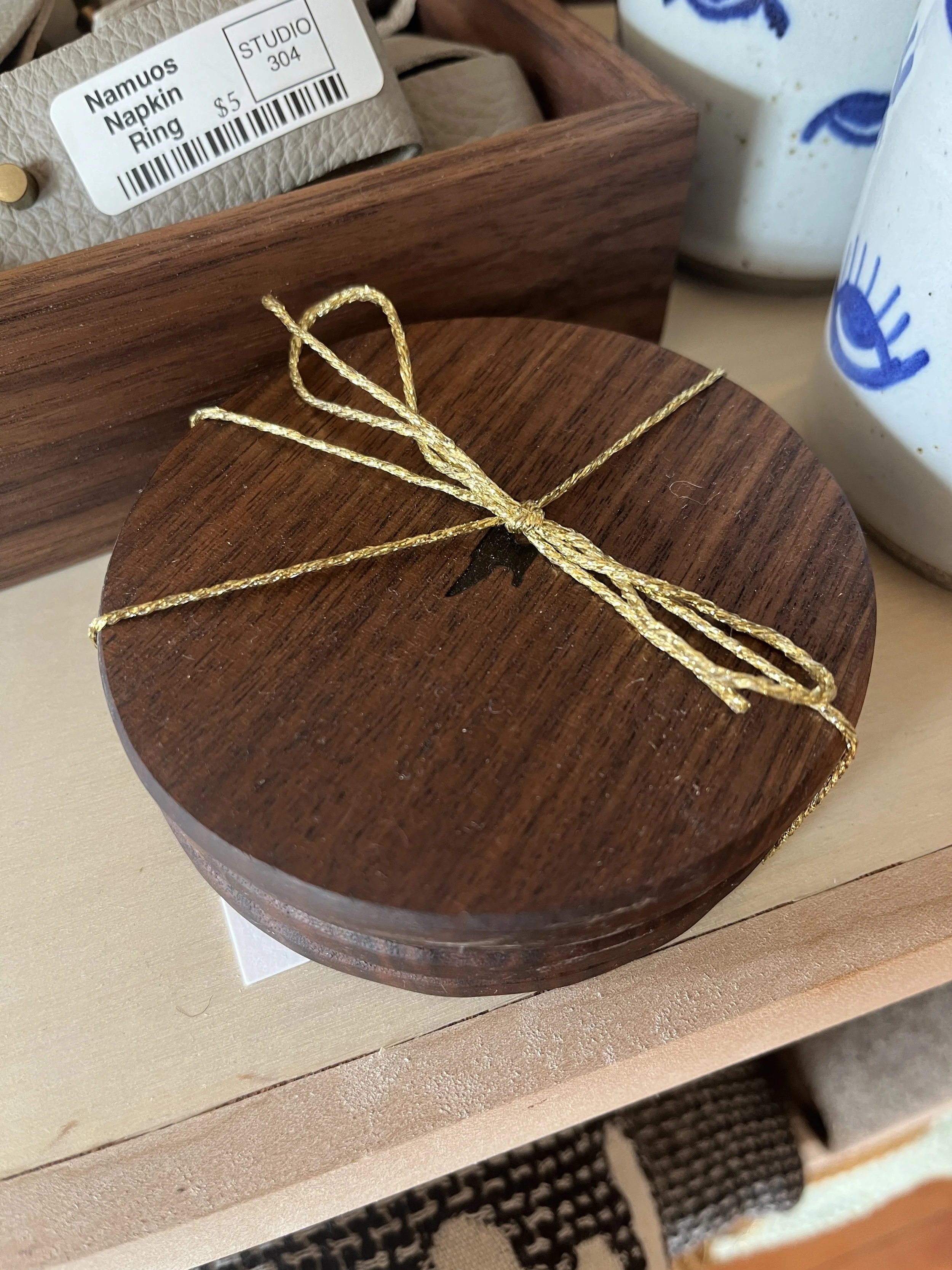 Four hand crafted wooden coasters tied together with twine designed by Schooner Creek Designs