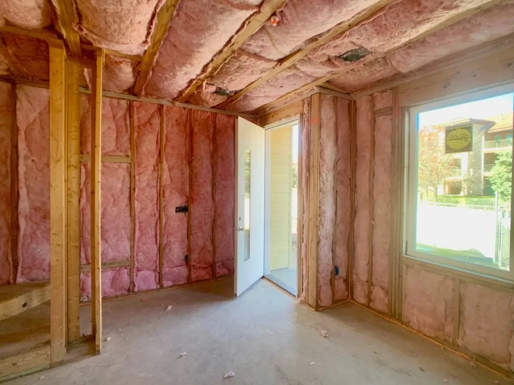  Image of the inside of a Lively Lane Phase 1 live-work townhome, with insulation installed. 