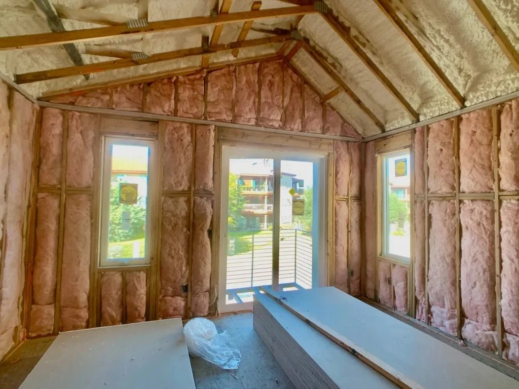  Image of the inside of a Lively Lane Phase 1 live-work townhome, with insulation installed. 