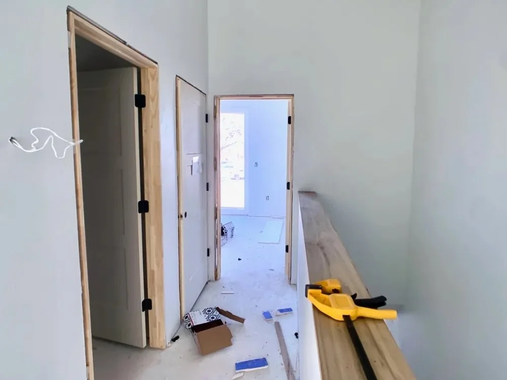  Image of Lively Lane Phase 1 townhome interior with door frames being installed. 