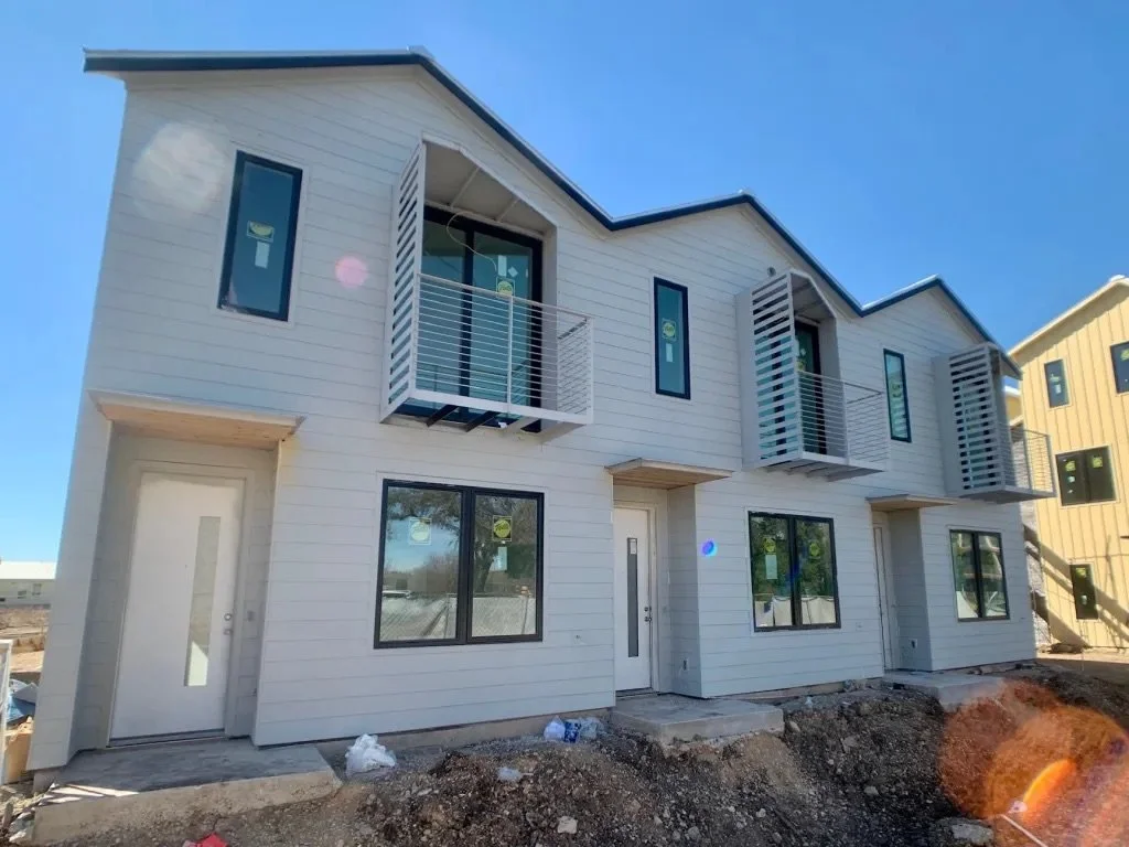  Image of the exterior of a Lively Lane Phase 1 townhome fiber cement siding painted. 