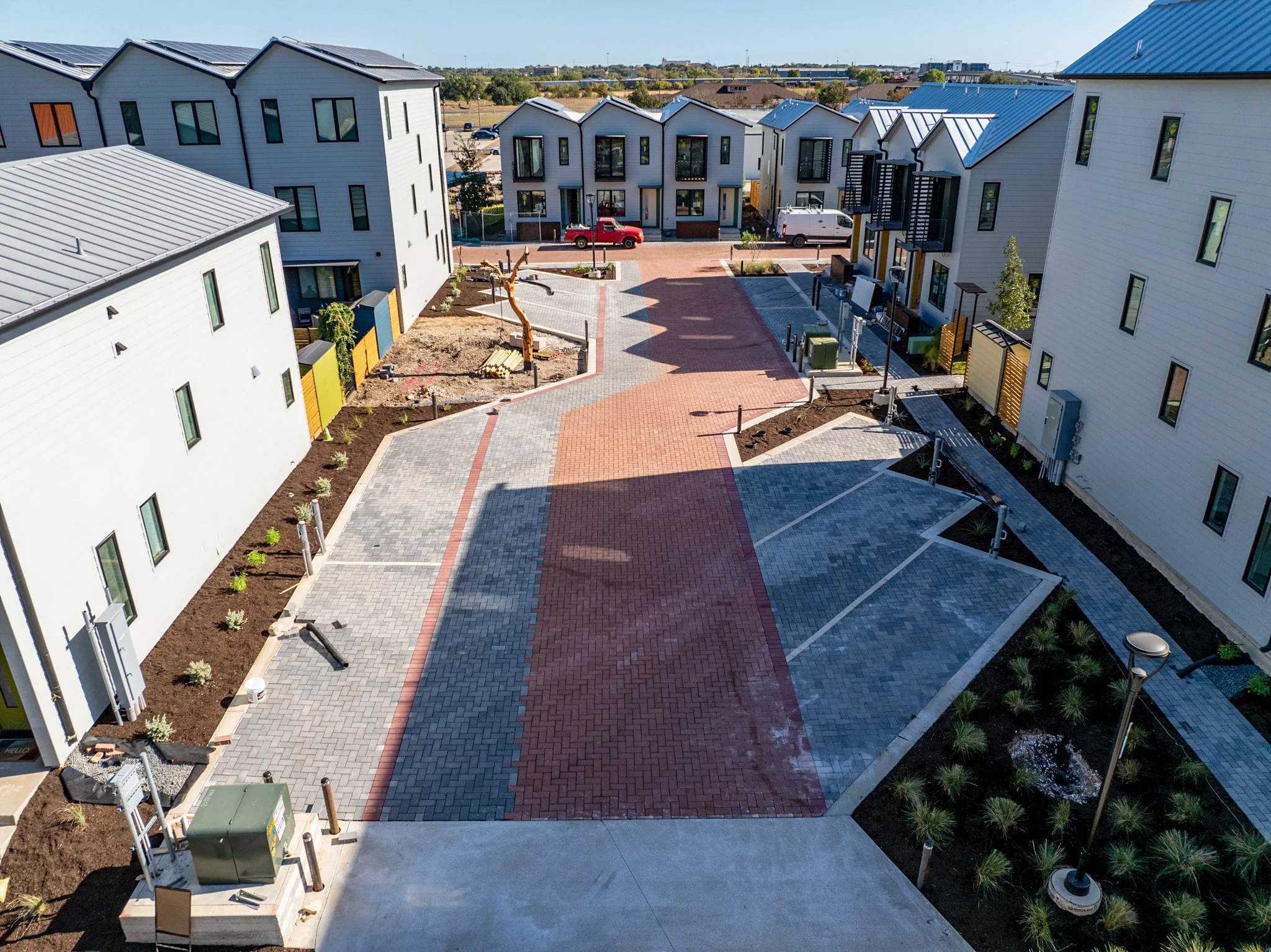  Lively Ln. second entrance from Dutton showcasing the finished landscaping and permeable paver system. 