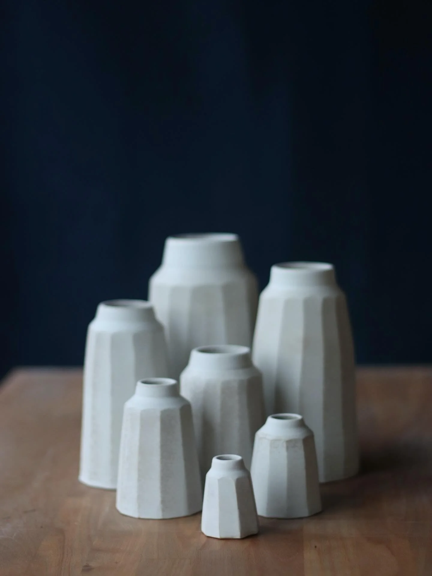 l'm not quite sure what happened with these vases. The original plan was to make just one size in each clay body, but I felt compelled to keep throwing, and somehow these extended families emerged.

Admittedly, many of my forms exist in multiple size