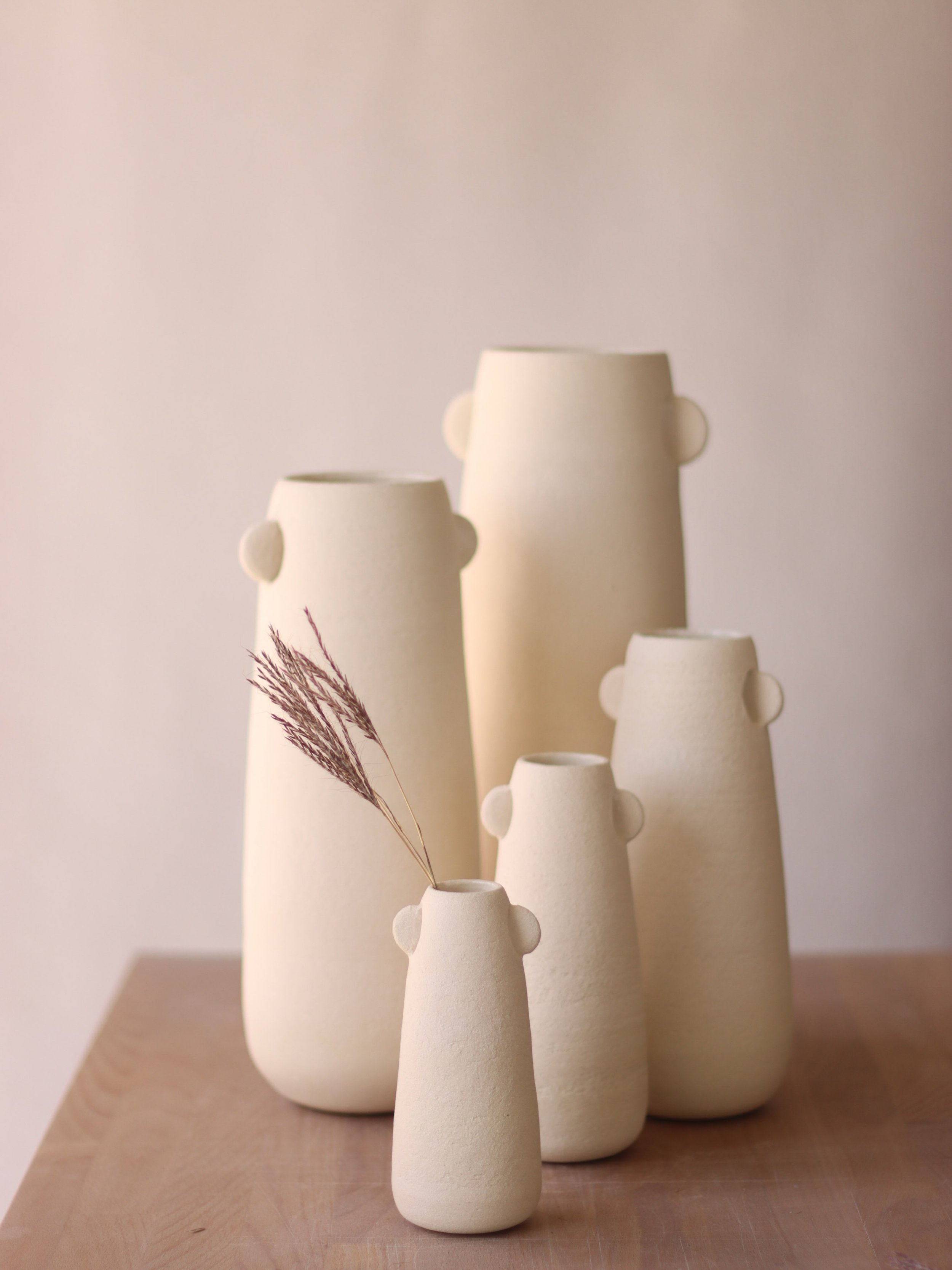 A family of ear vases, still hot from the last kiln before a much-needed summer break to spend time with my flesh-and-blood family ☀️

#HandmadeCeramics #MeetTheFamily
